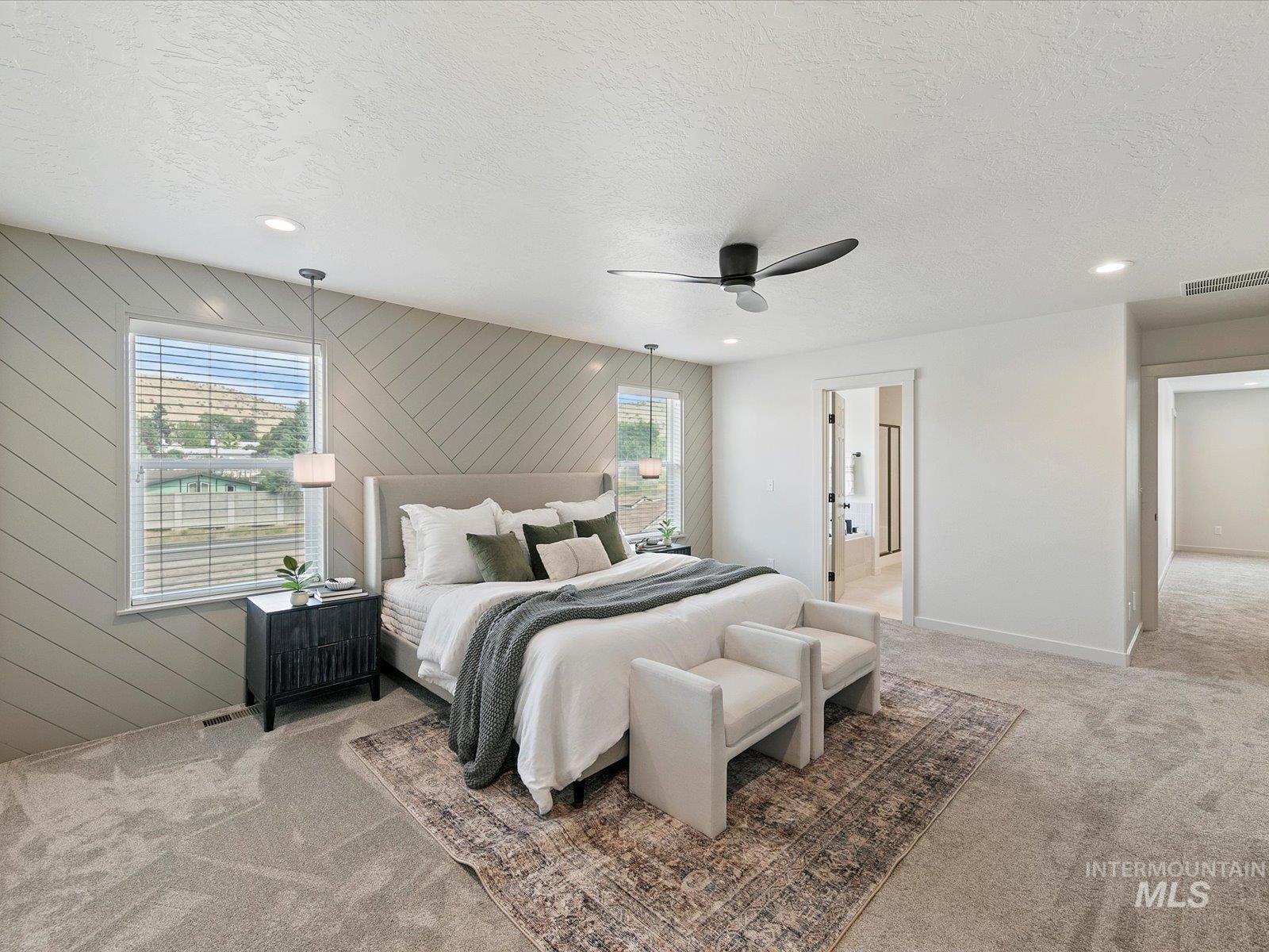 Bedroom with light colored carpet, a textured ceiling, a ceiling fan, recessed lighting, and wood walls