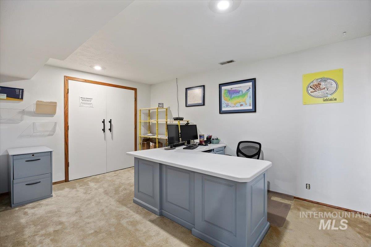 Home office featuring light carpet and recessed lighting