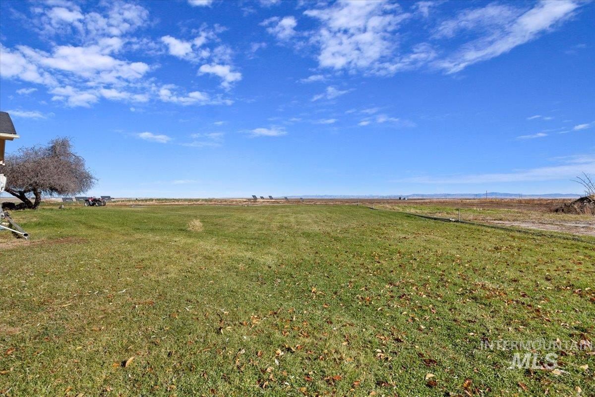 View of grassy yard featuring a rural view