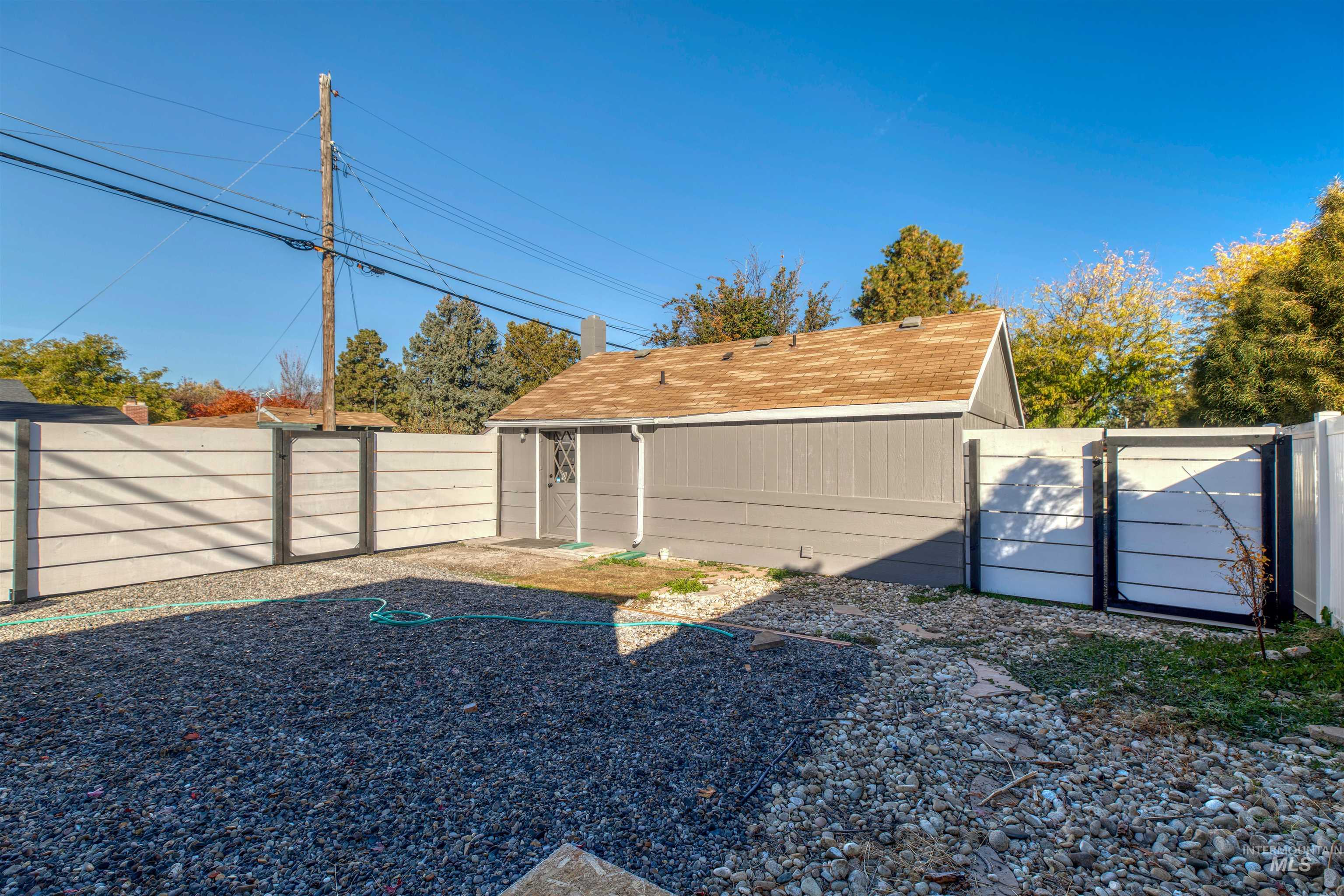 Fenced backyard with a gate