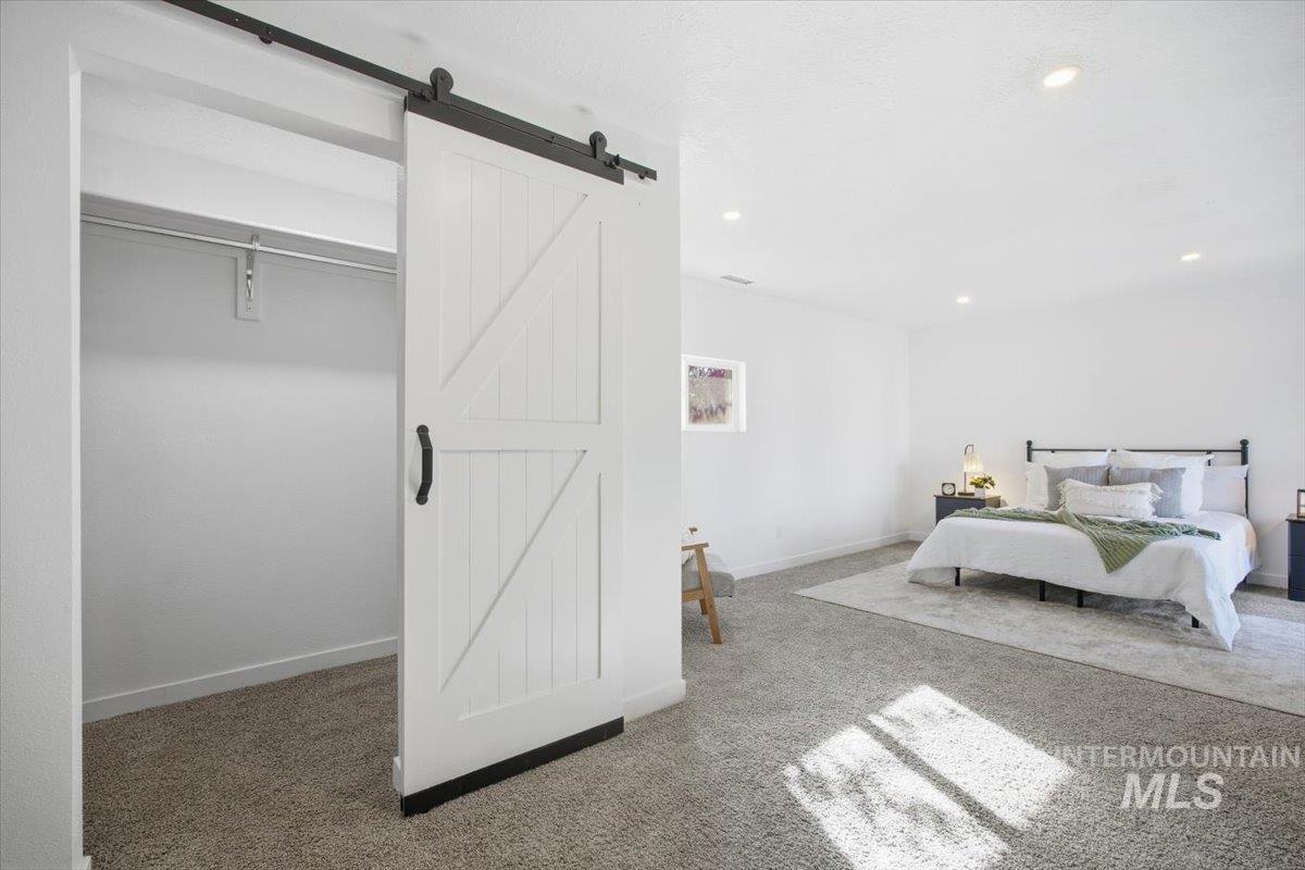 Bedroom featuring carpet and recessed lighting