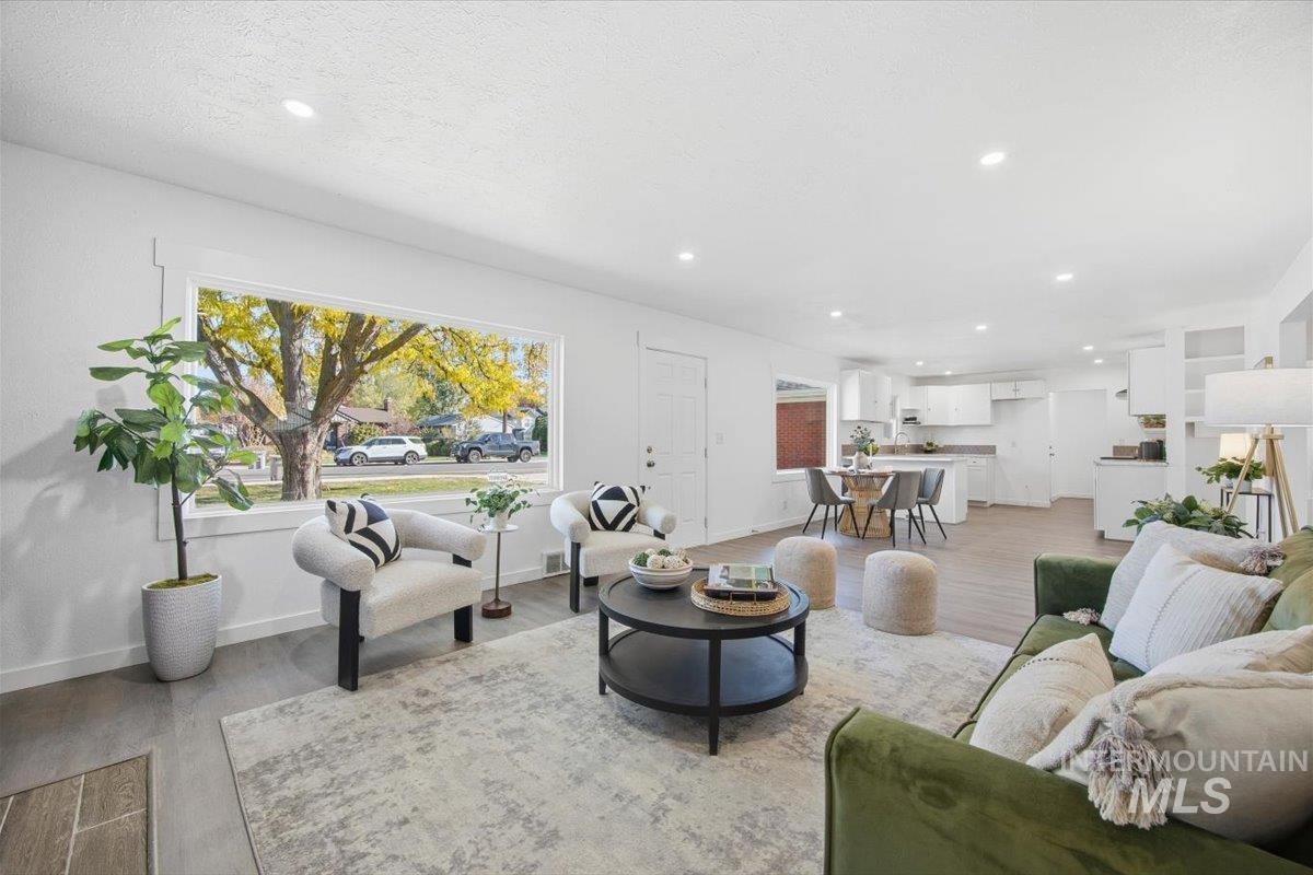 Living room featuring light wood-style floors and recessed lighting