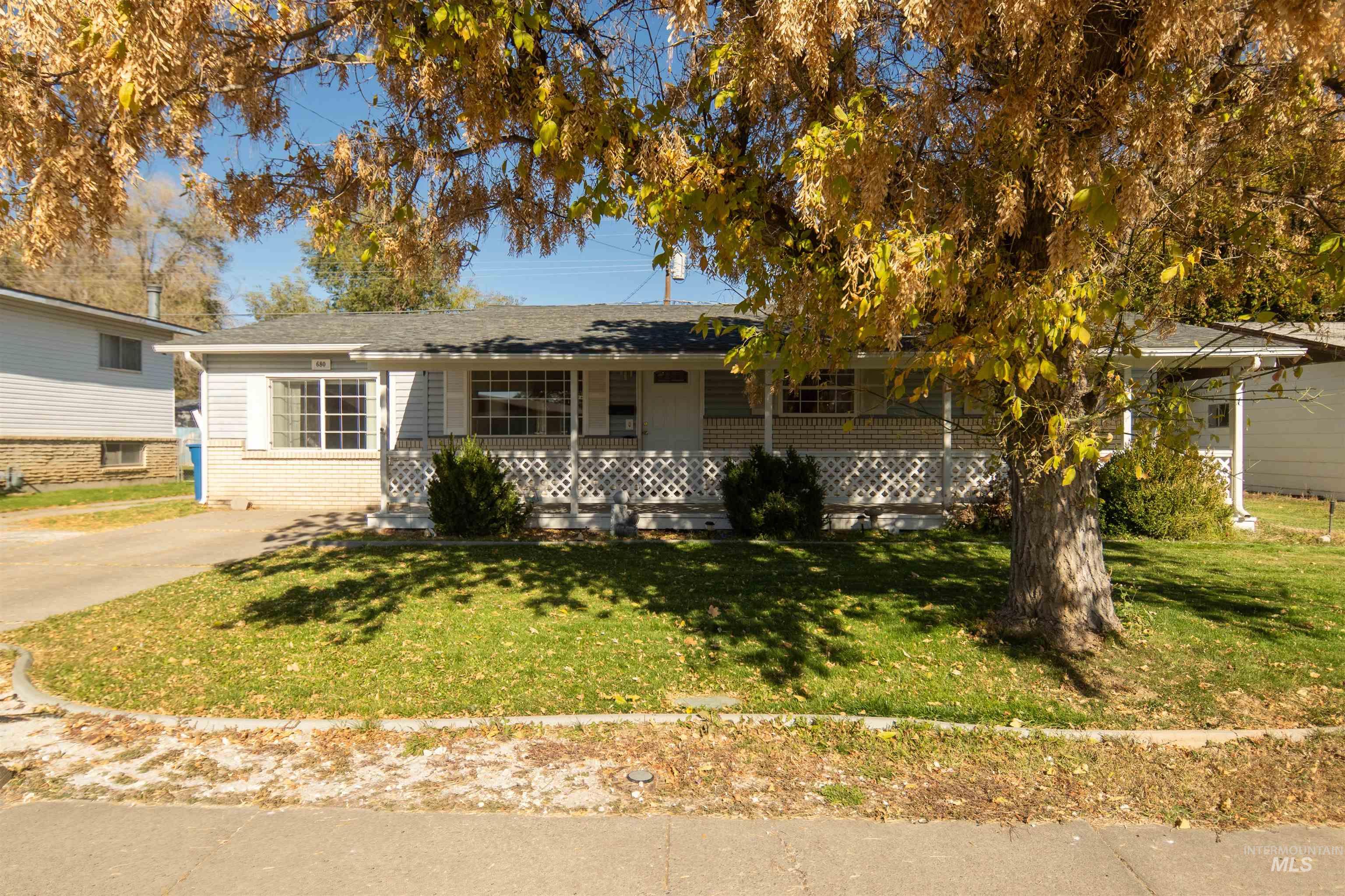 View of front of home featuring a porch and a front lawn