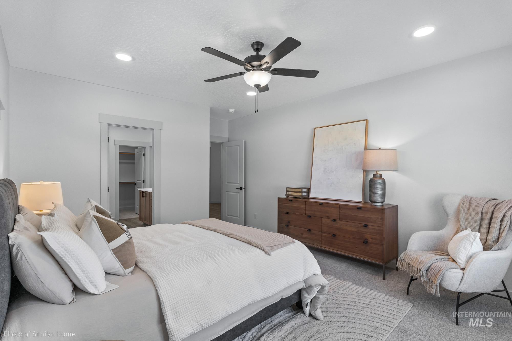 Bedroom with carpet flooring, a ceiling fan, and recessed lighting