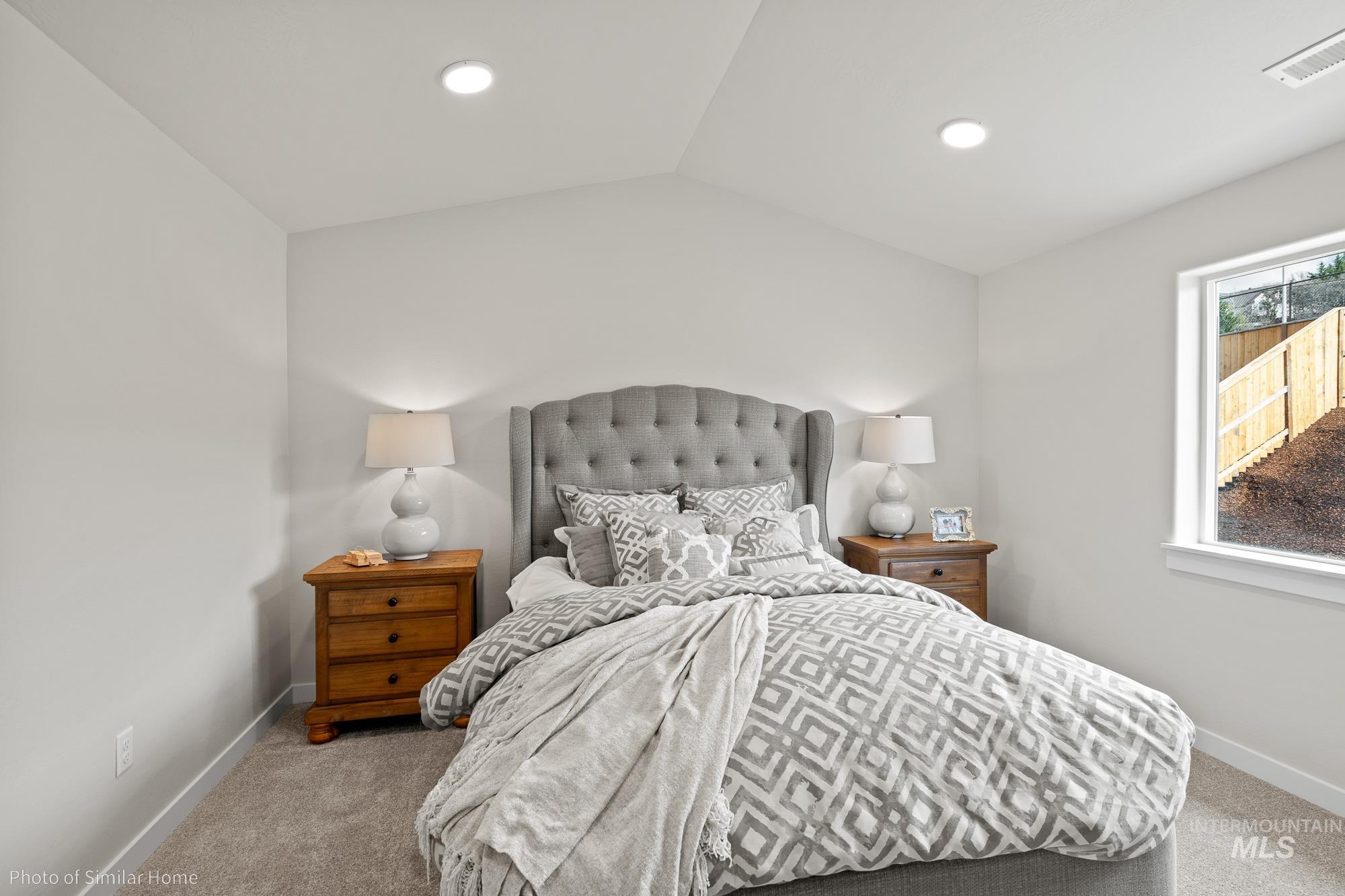 Carpeted bedroom with baseboards and recessed lighting