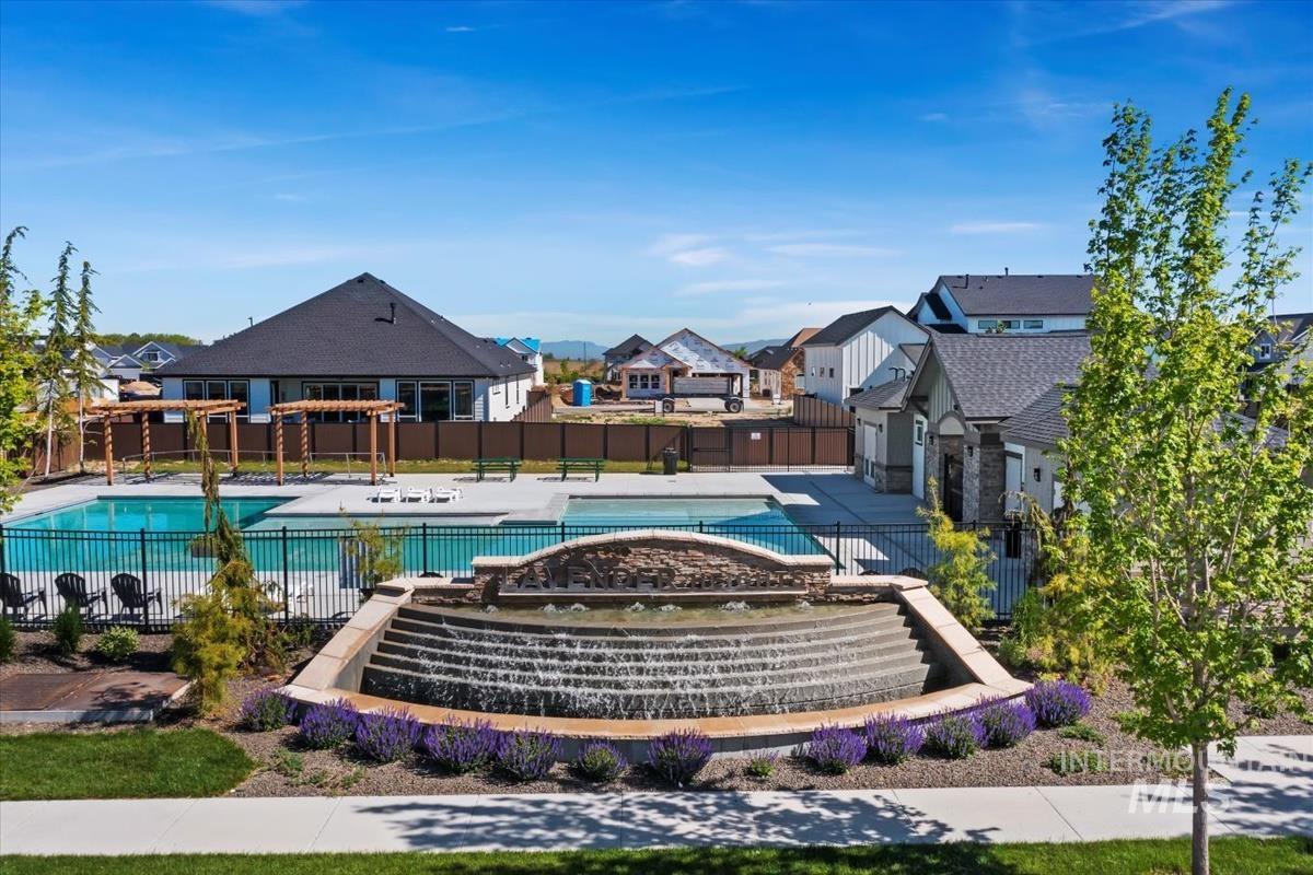 Community pool featuring a patio, a pergola, and a residential view