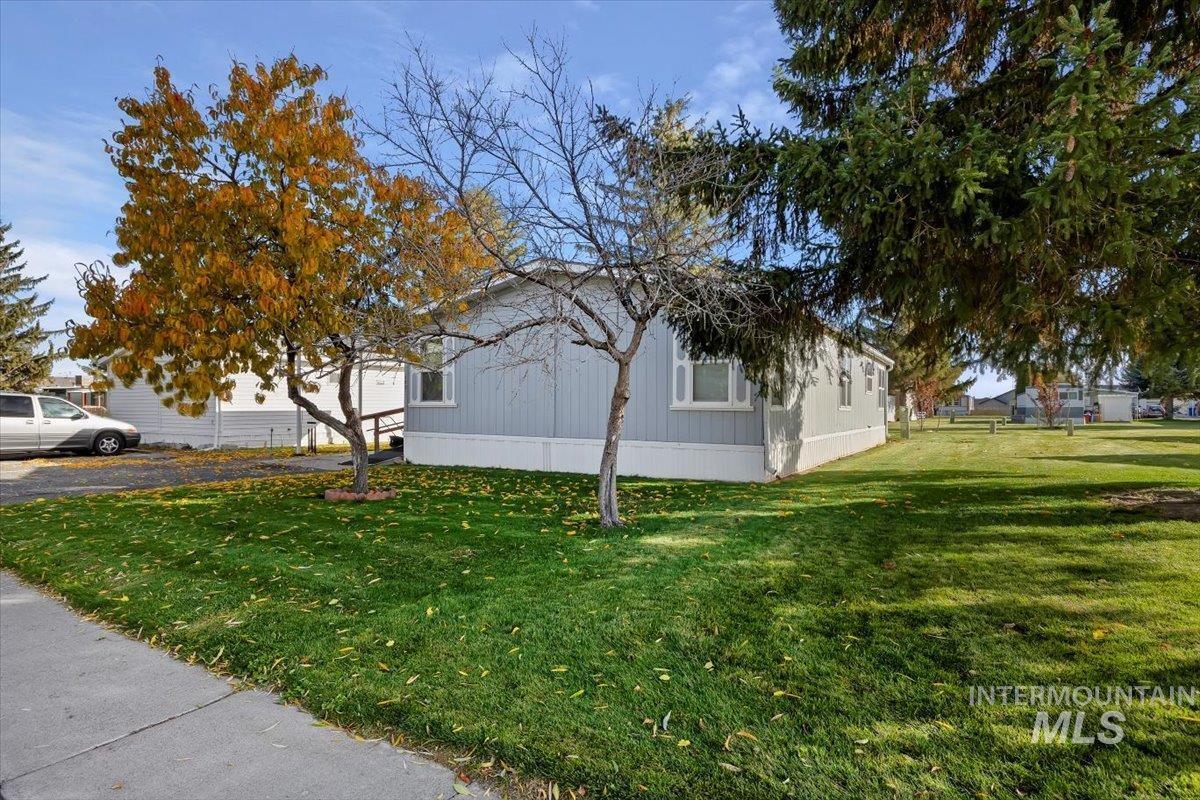 View of home's exterior with a lawn