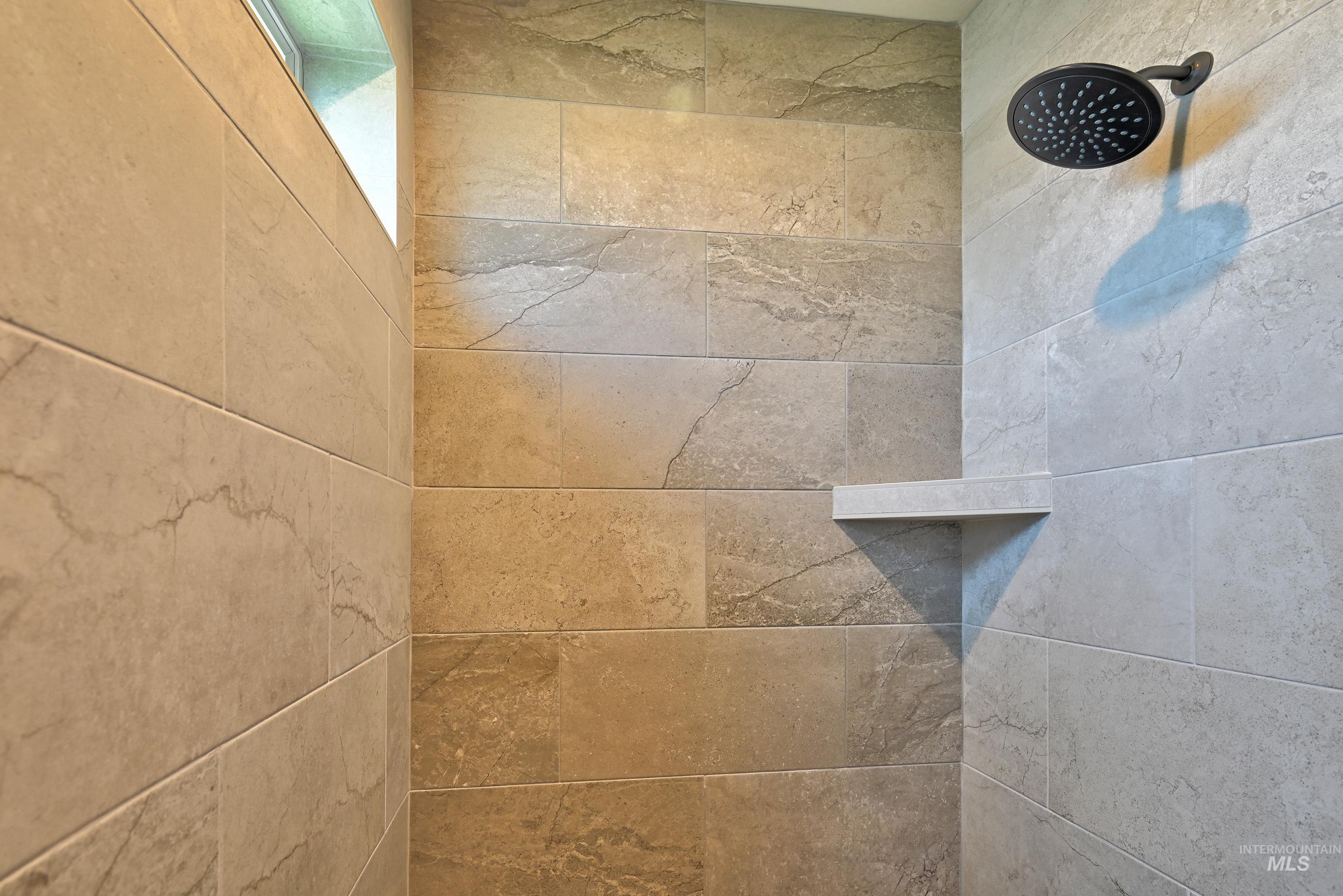 Bathroom view of tiled shower