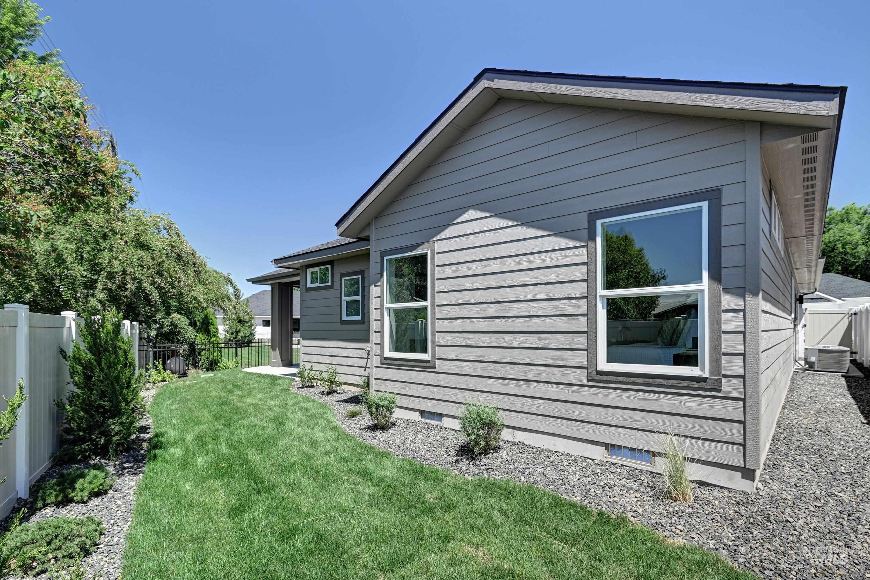 View of home's exterior with a fenced backyard and crawl space