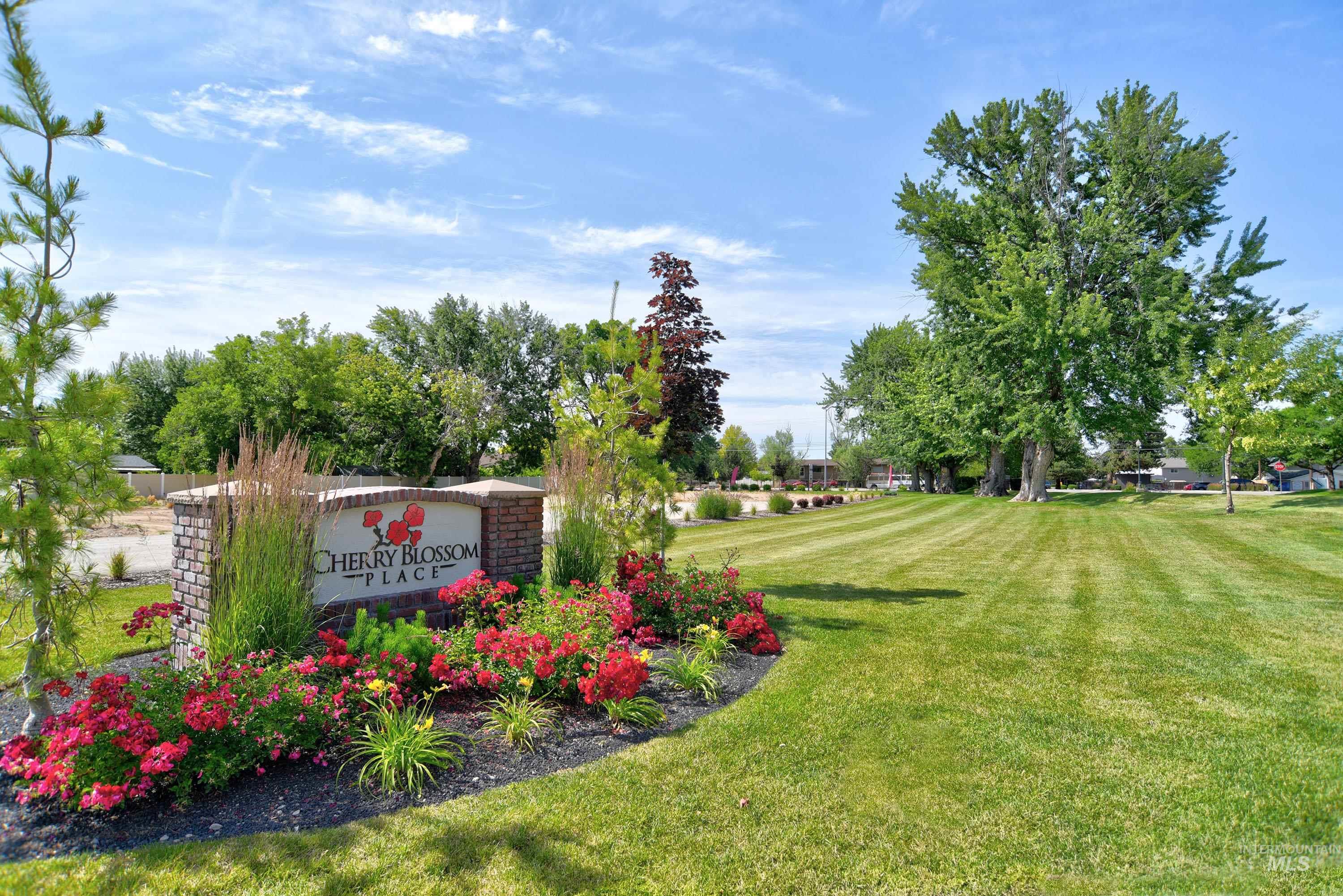 Community sign featuring a lawn