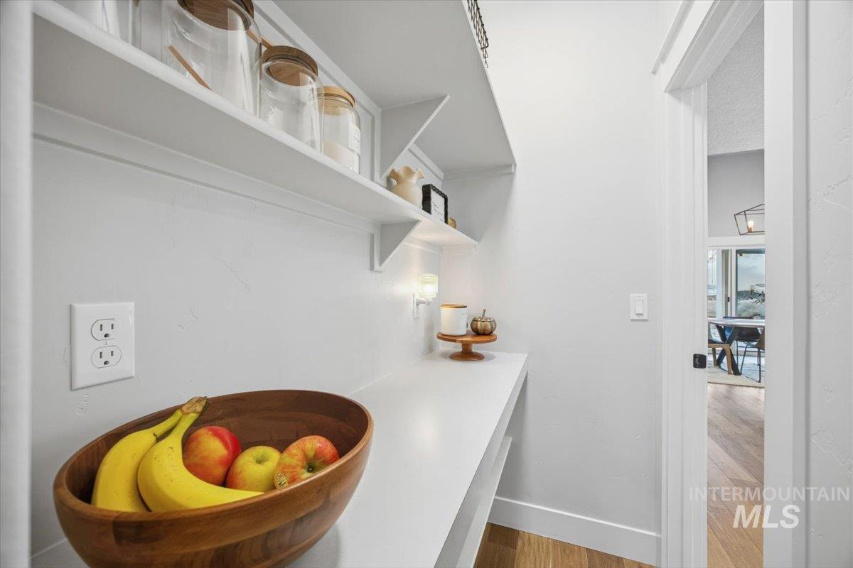 Interior space with wood finished floors and baseboards