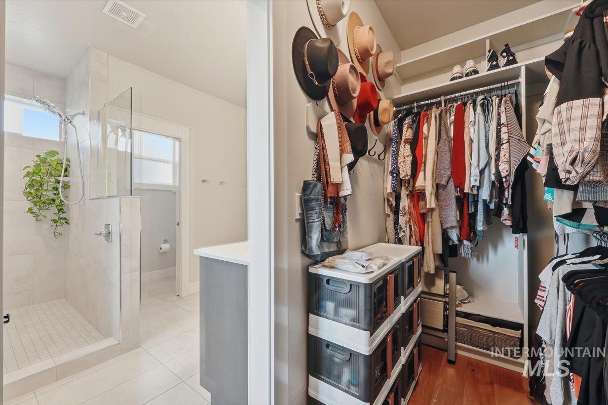 Spacious closet with tile patterned flooring