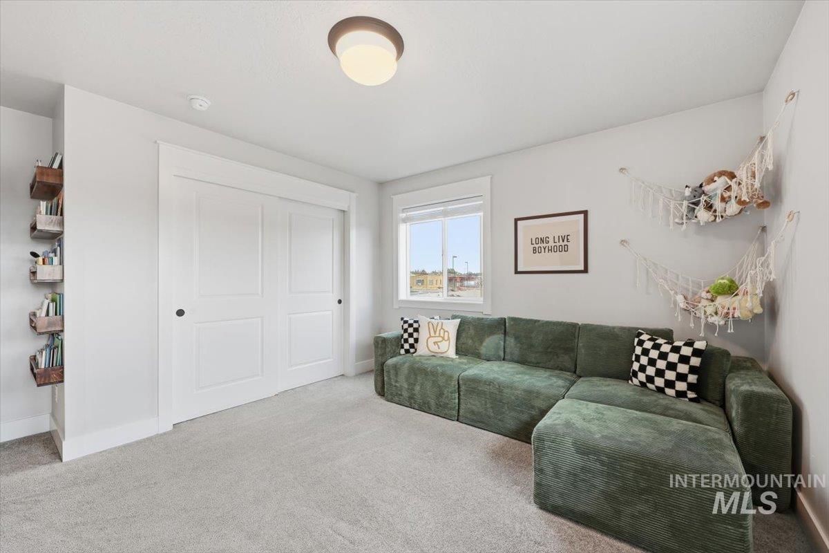 Living area featuring carpet