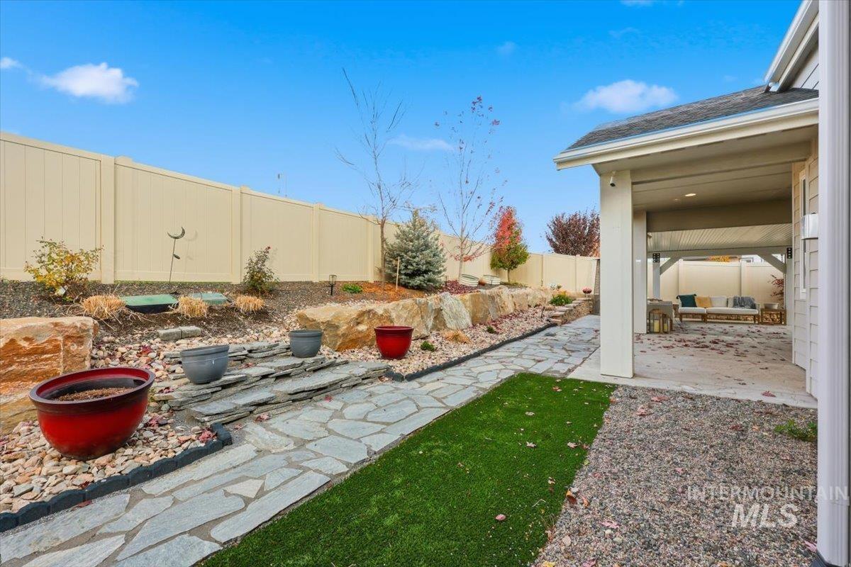 Fenced backyard featuring a patio area