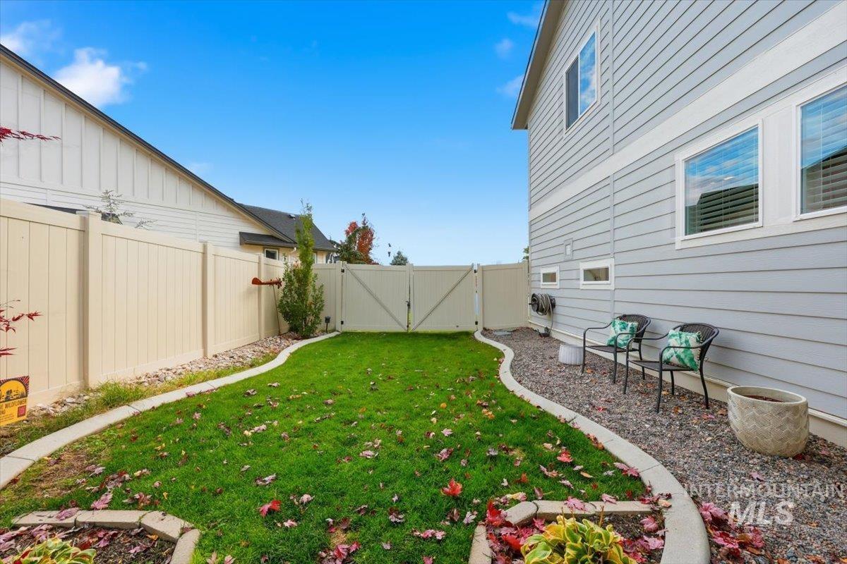Fenced backyard with a gate