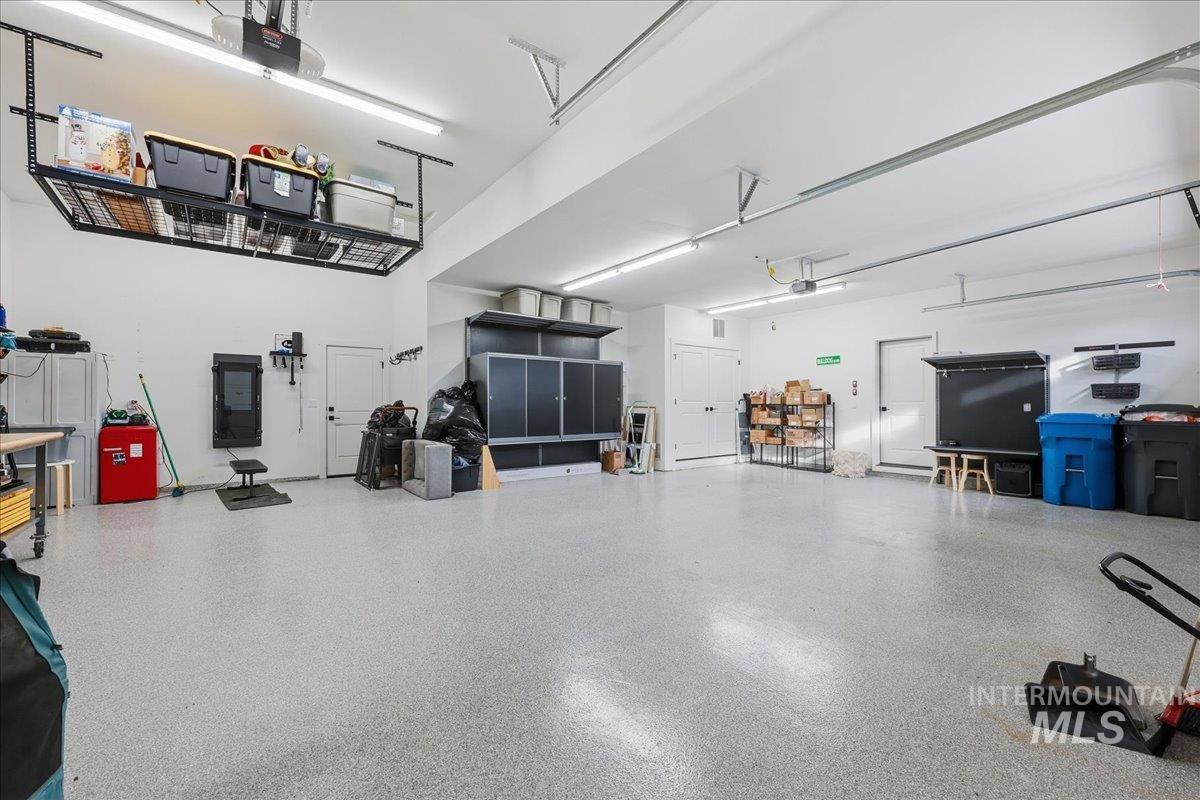 Garage featuring a garage door opener