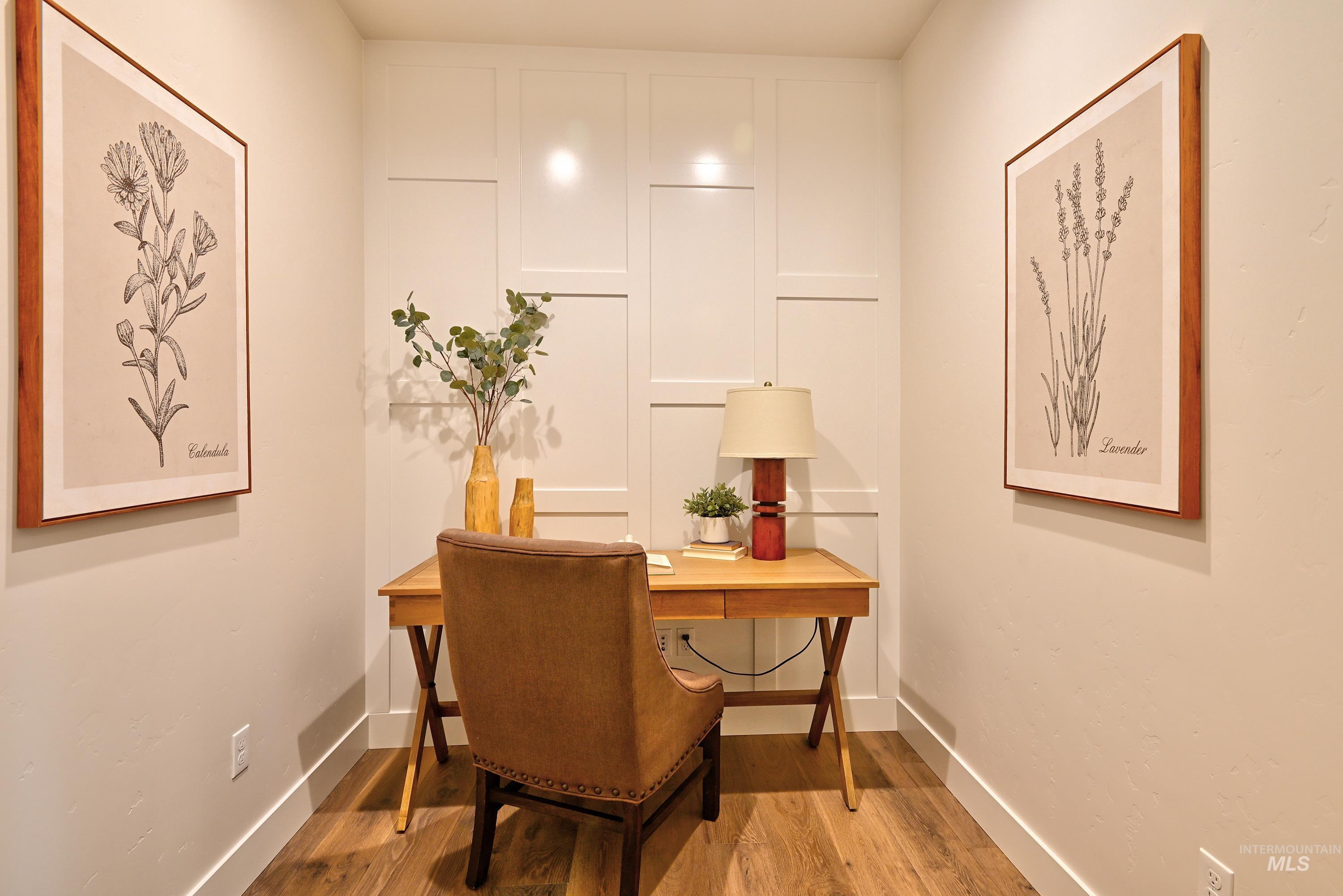 Office area featuring wood finished floors and baseboards