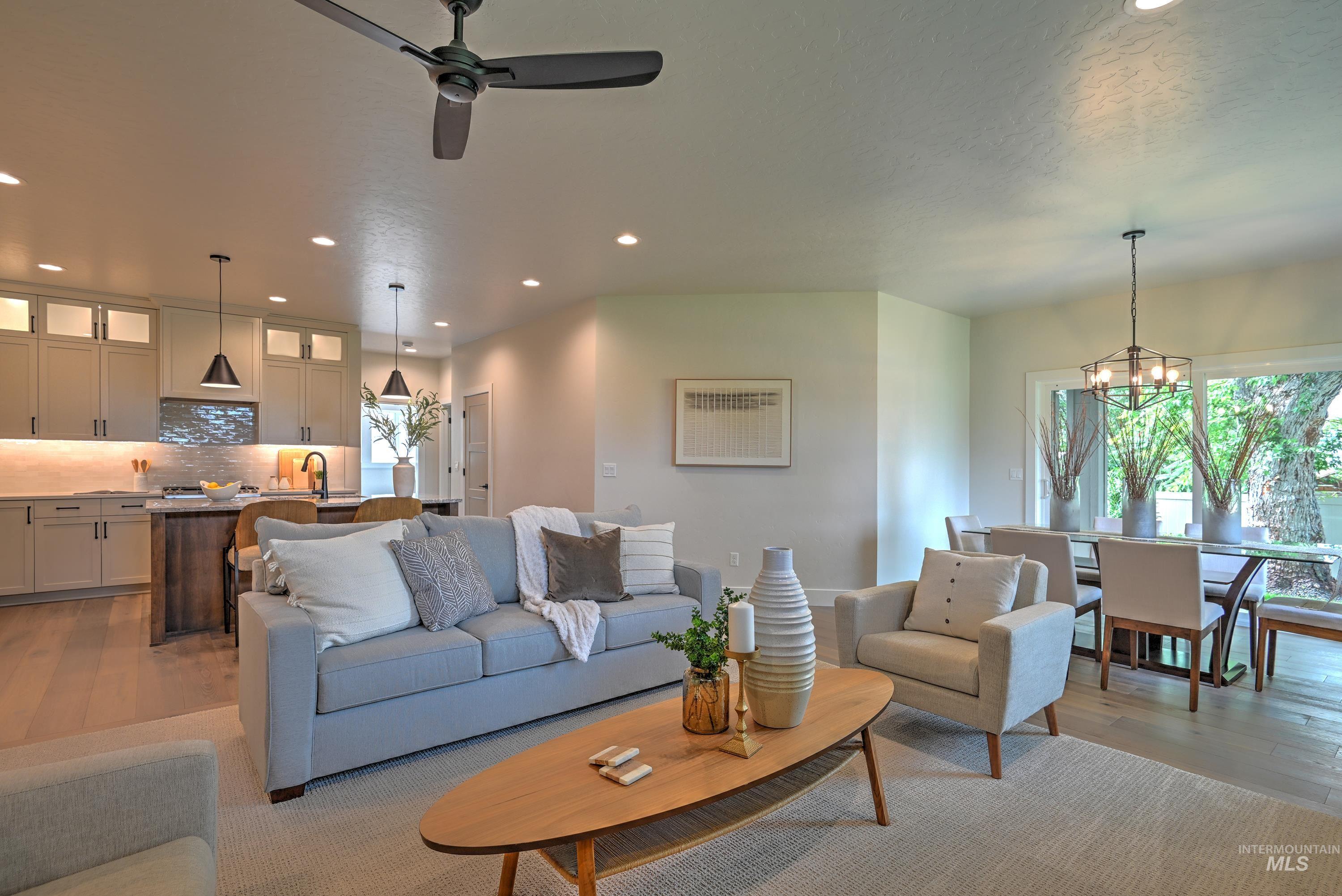Living area featuring light wood-style flooring, recessed lighting, ceiling fan