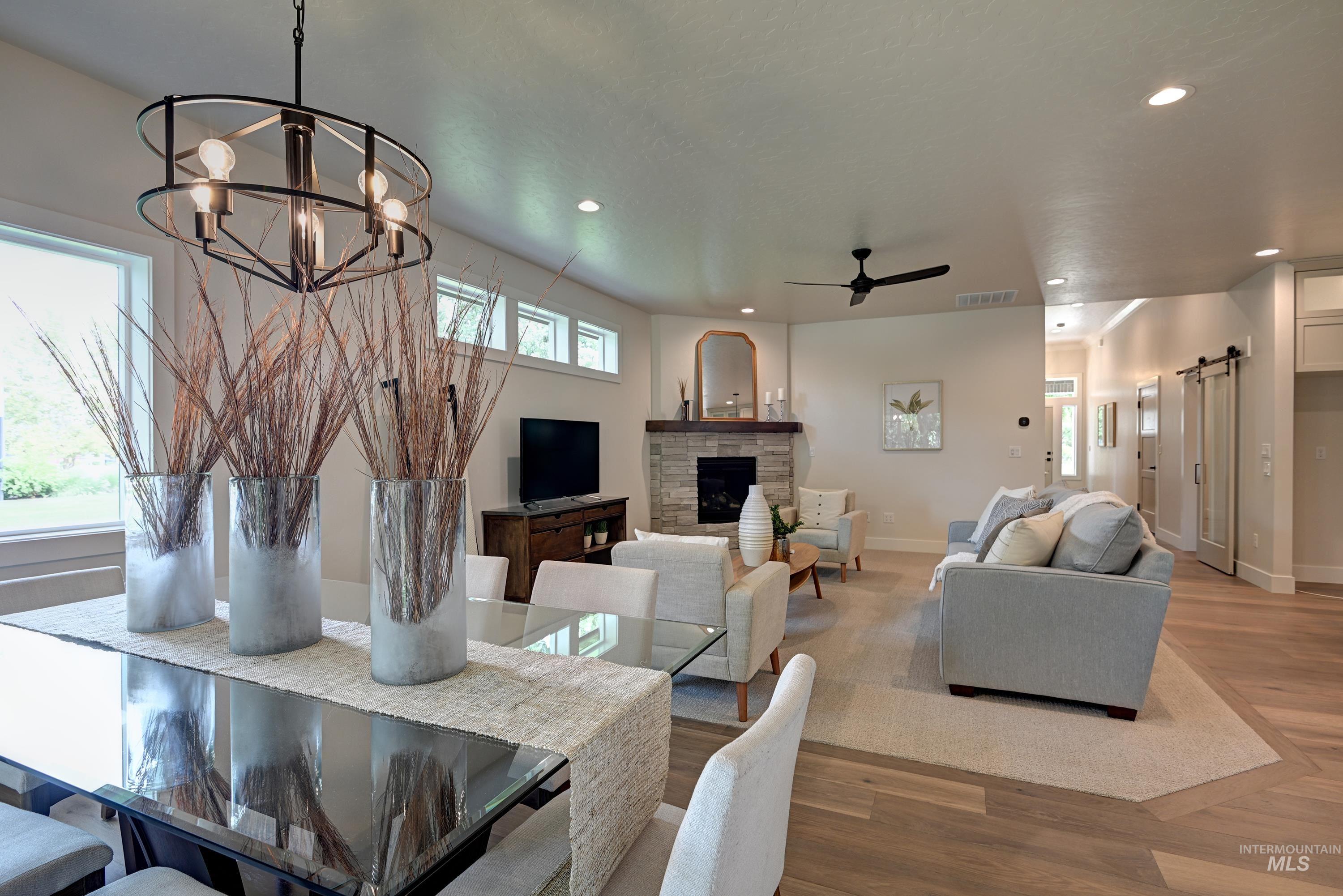 Dining area featuring wood finished floors, chandelier