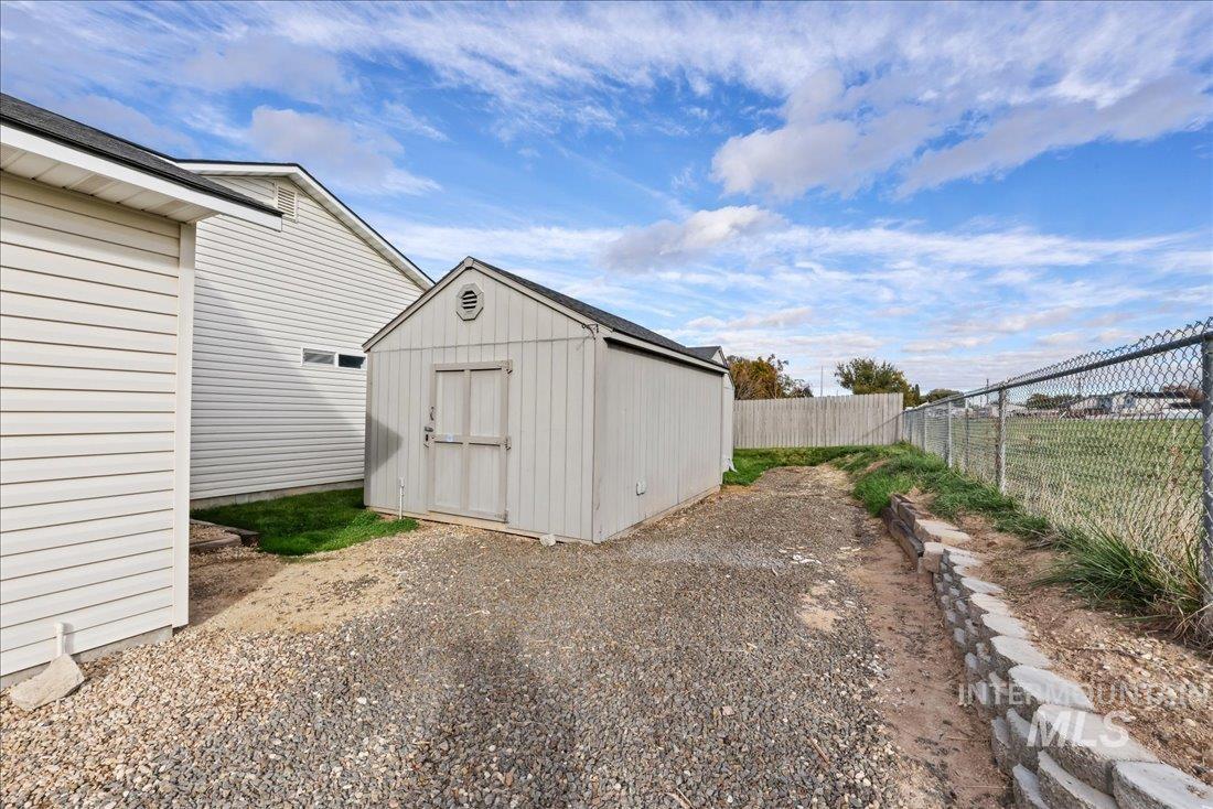 View of shed featuring a fenced backyard