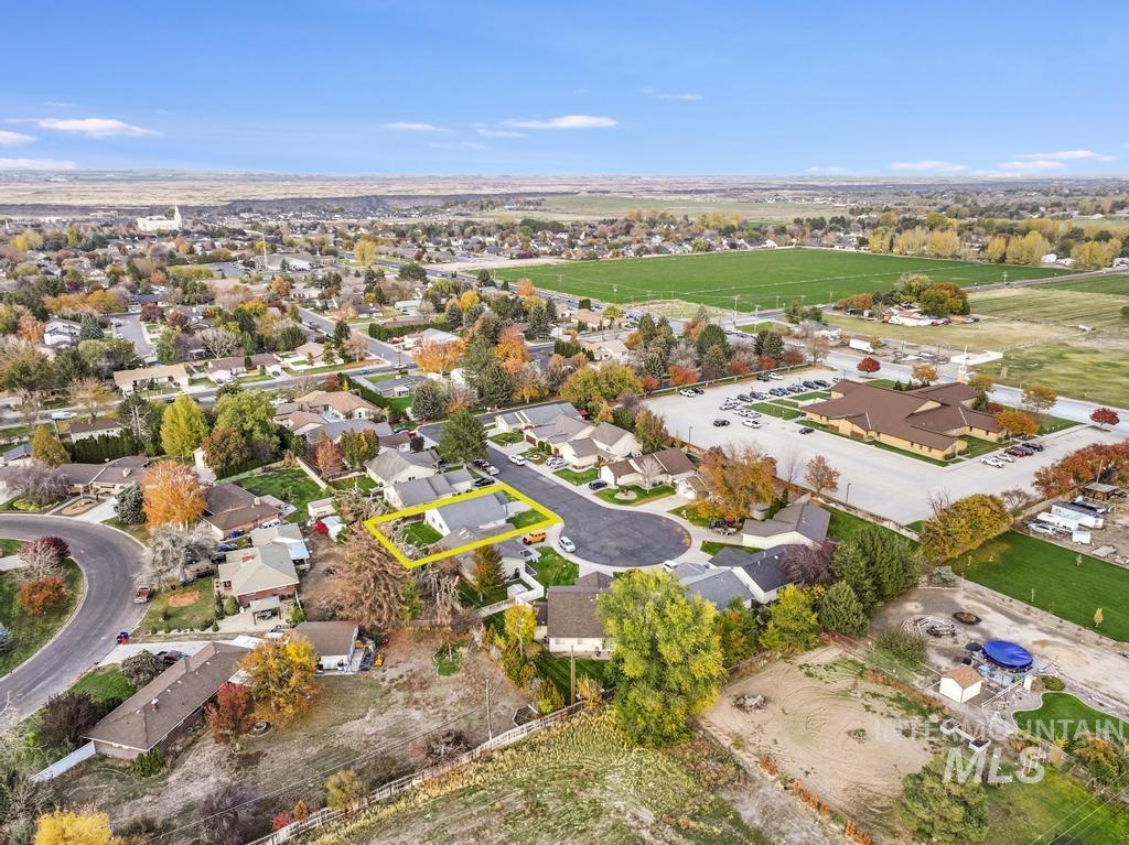 Aerial view of property's location with nearby suburban area and property boundaries highlighted