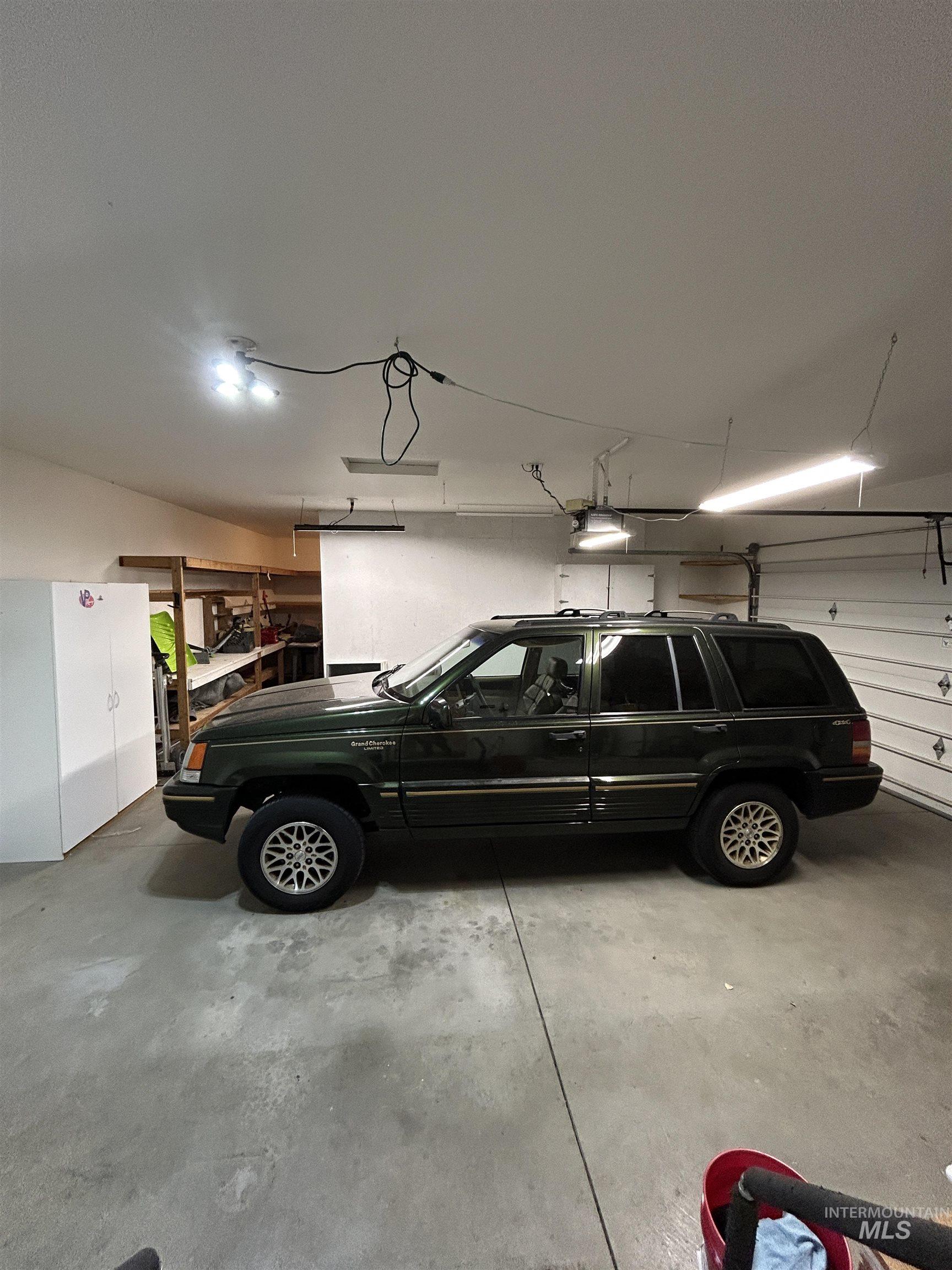 Garage featuring a garage door opener