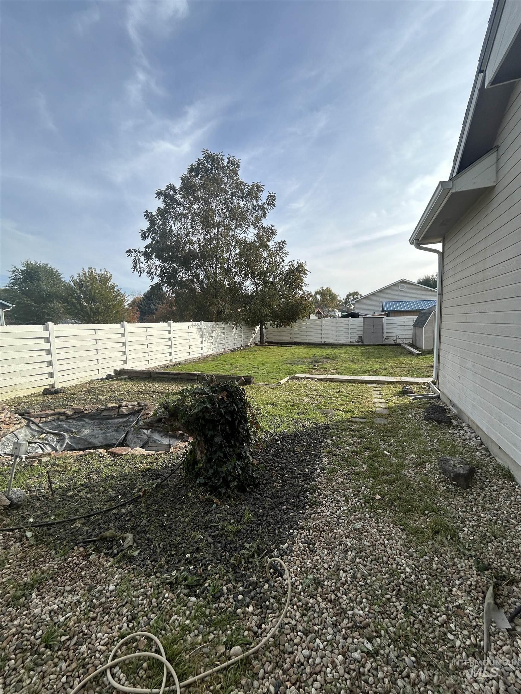 View of fenced backyard