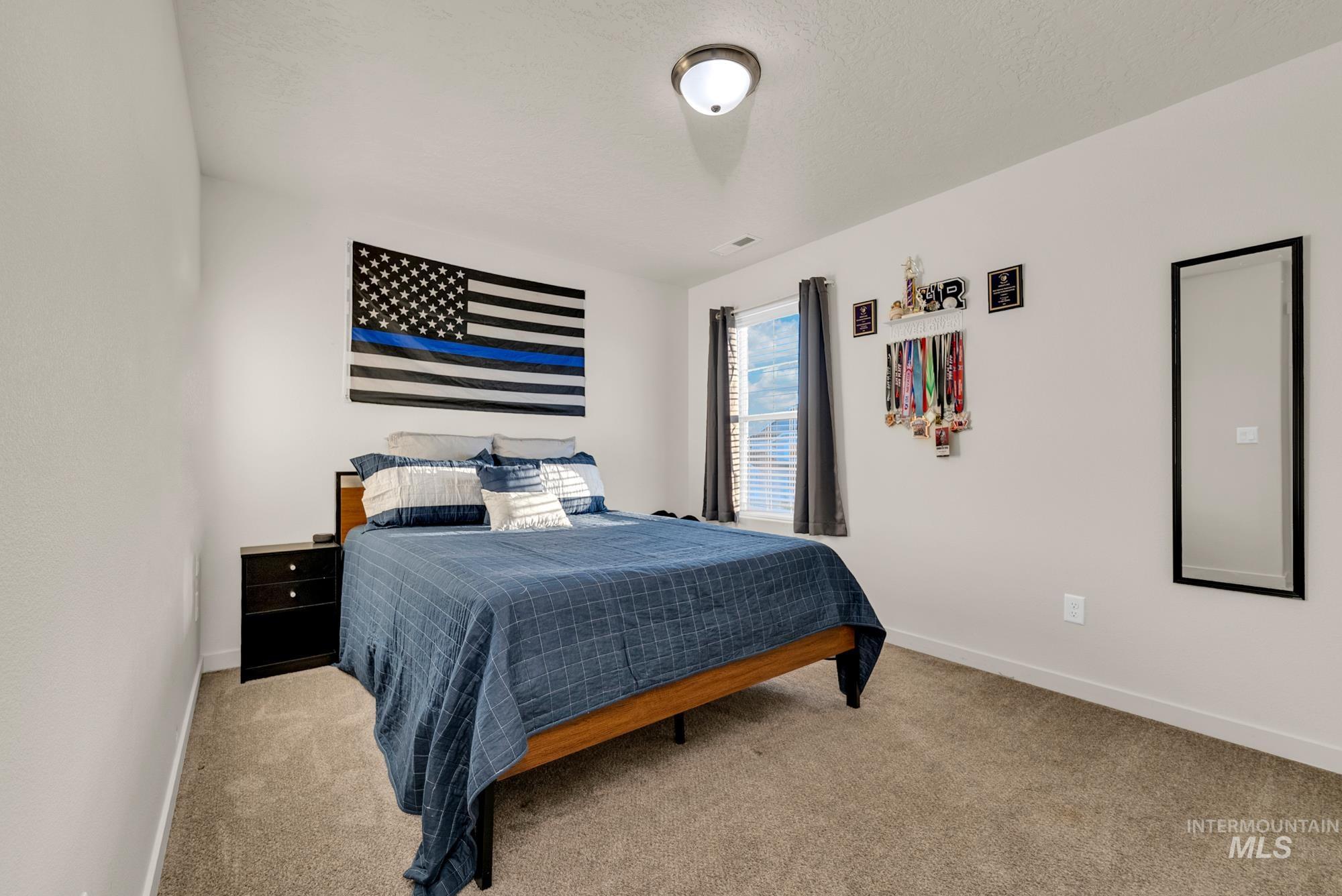 Bedroom featuring carpet flooring