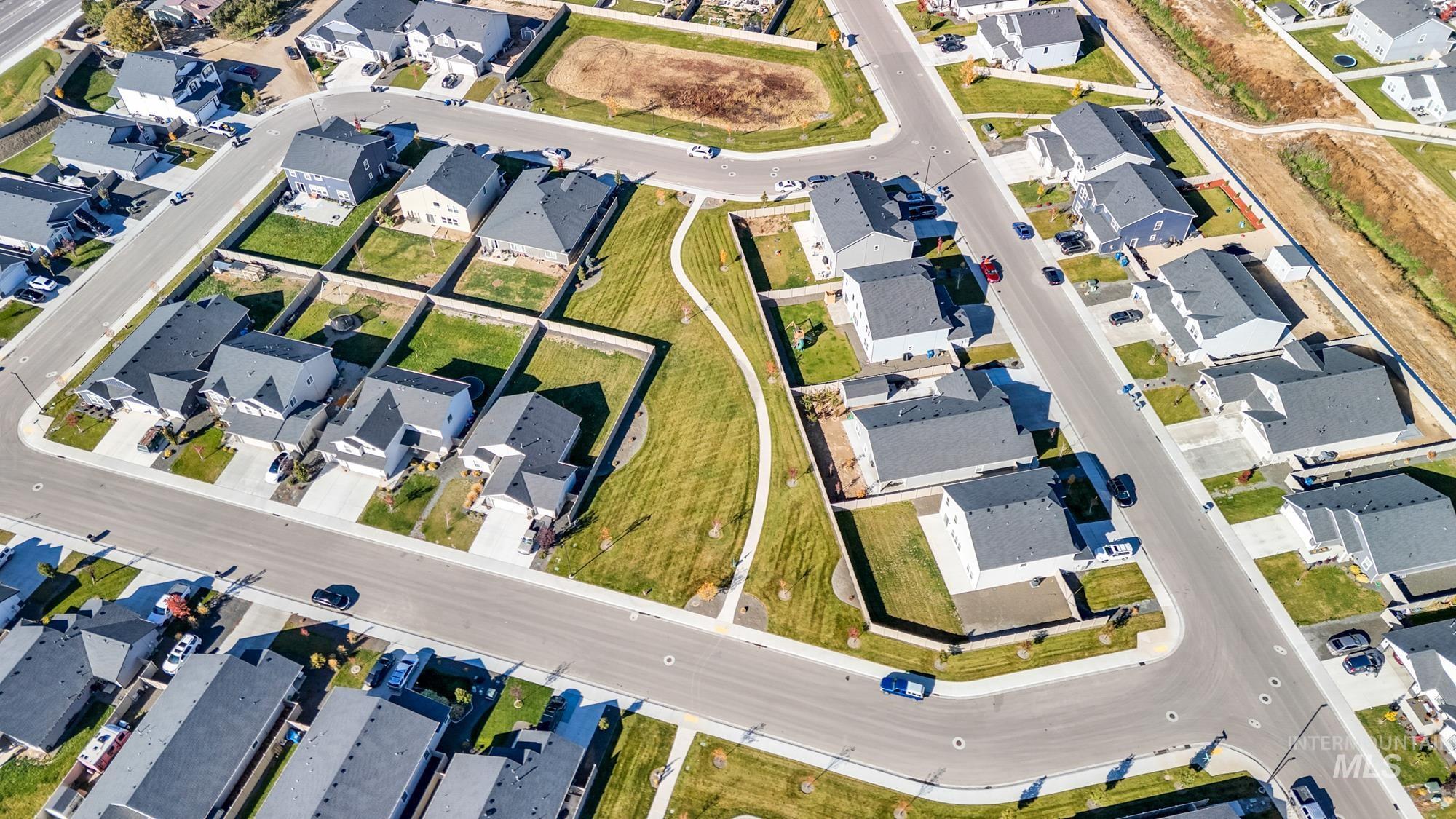 Aerial view of property's location with nearby suburban area