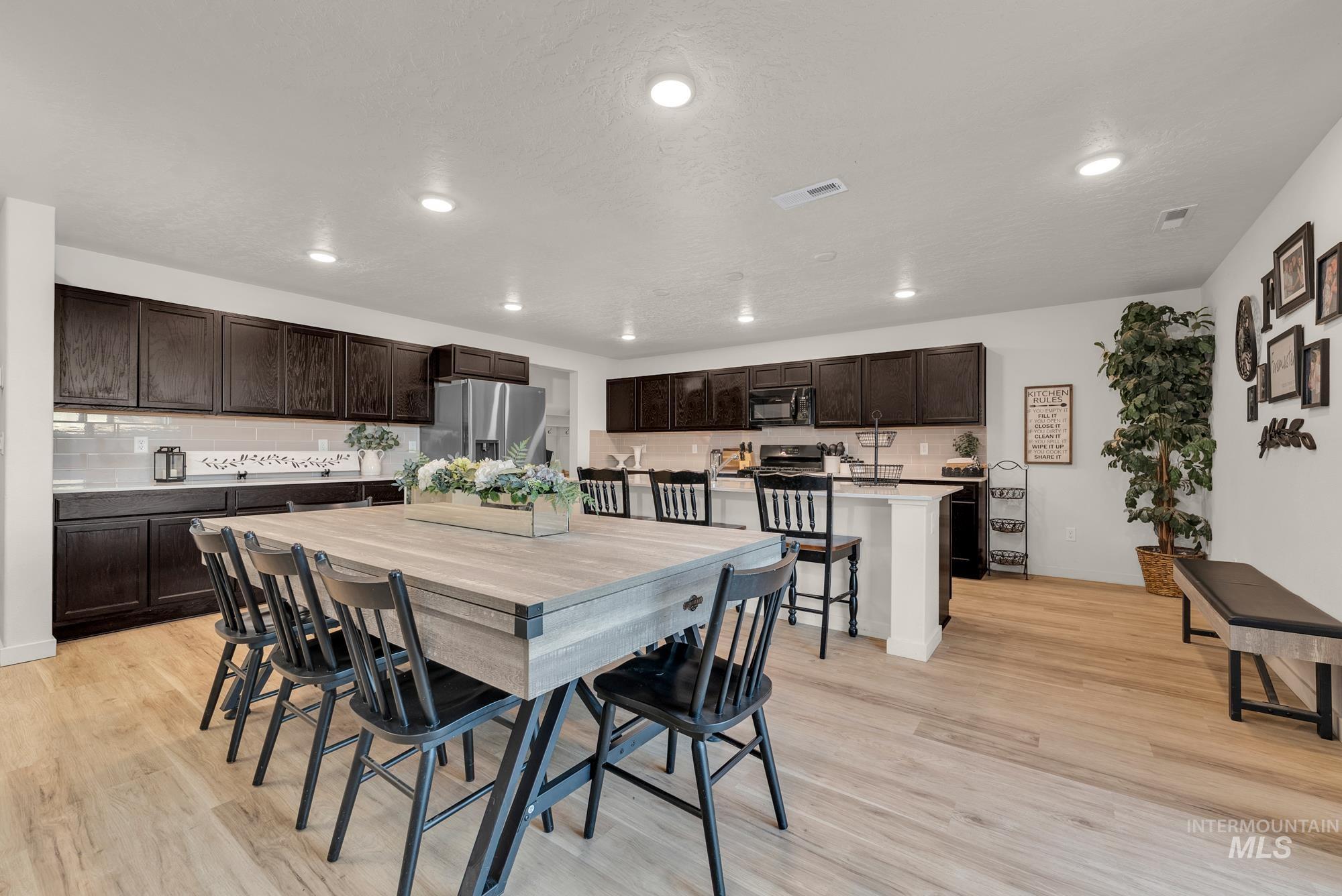 Dining room featuring recessed lighting and light wood finished floors