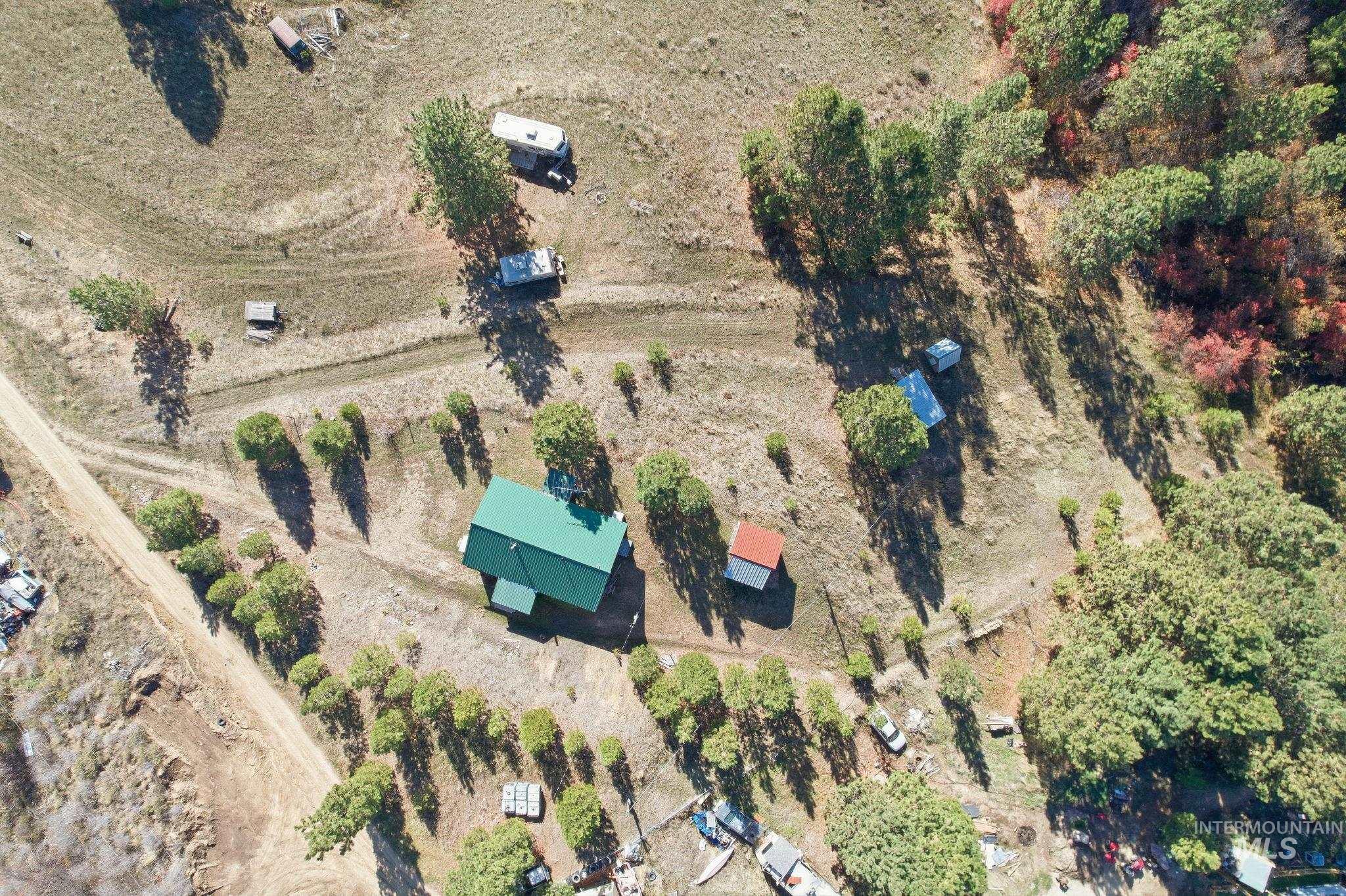 Aerial view of property and surrounding area with rural landscape