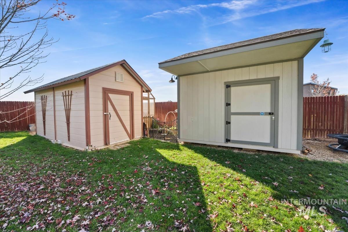 View of shed featuring a fenced backyard
