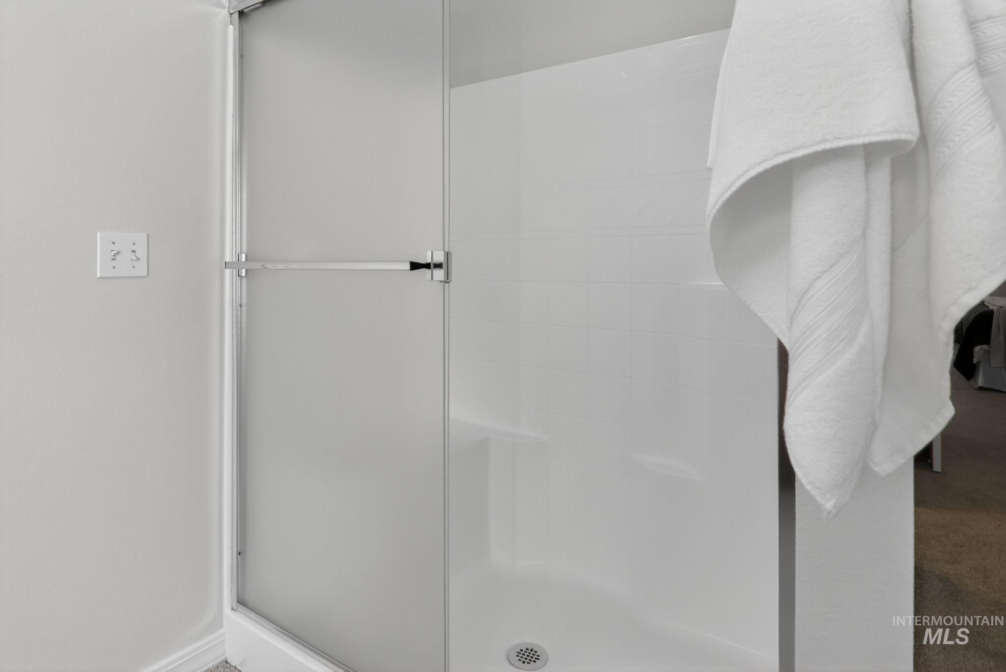 Bathroom featuring a shower stall