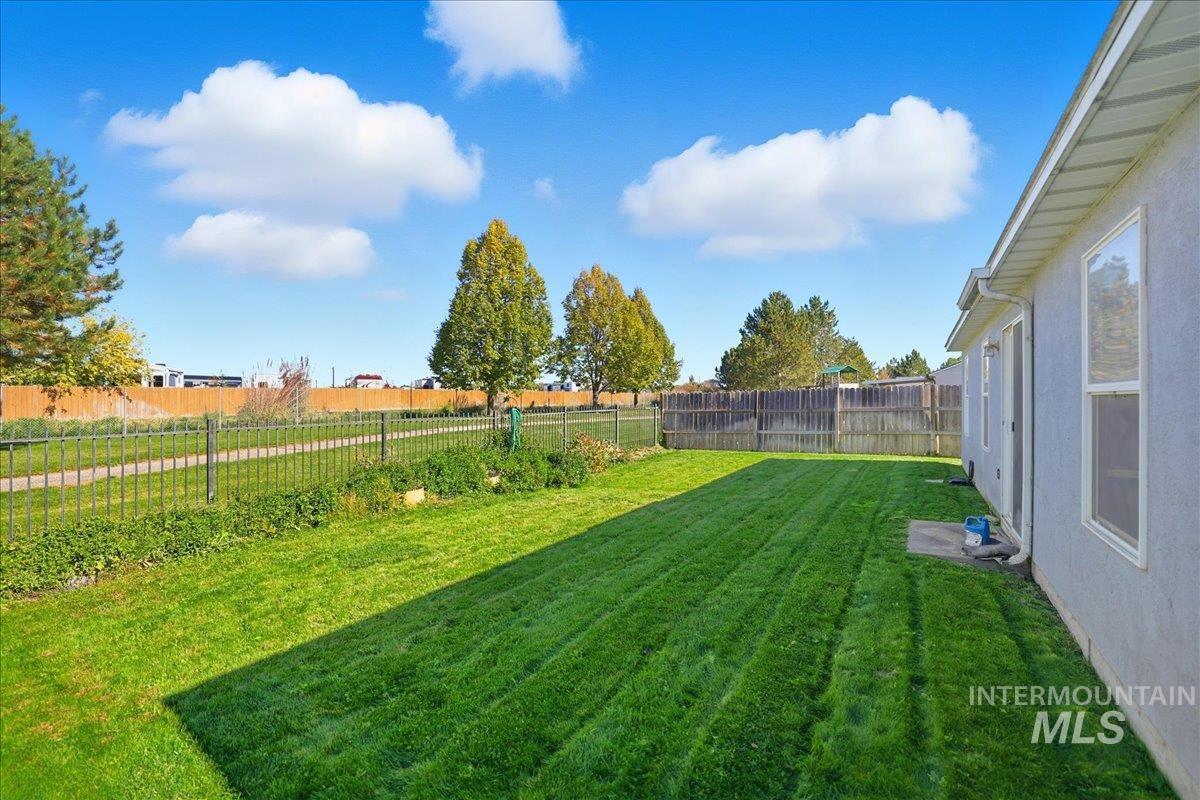 View of fenced backyard