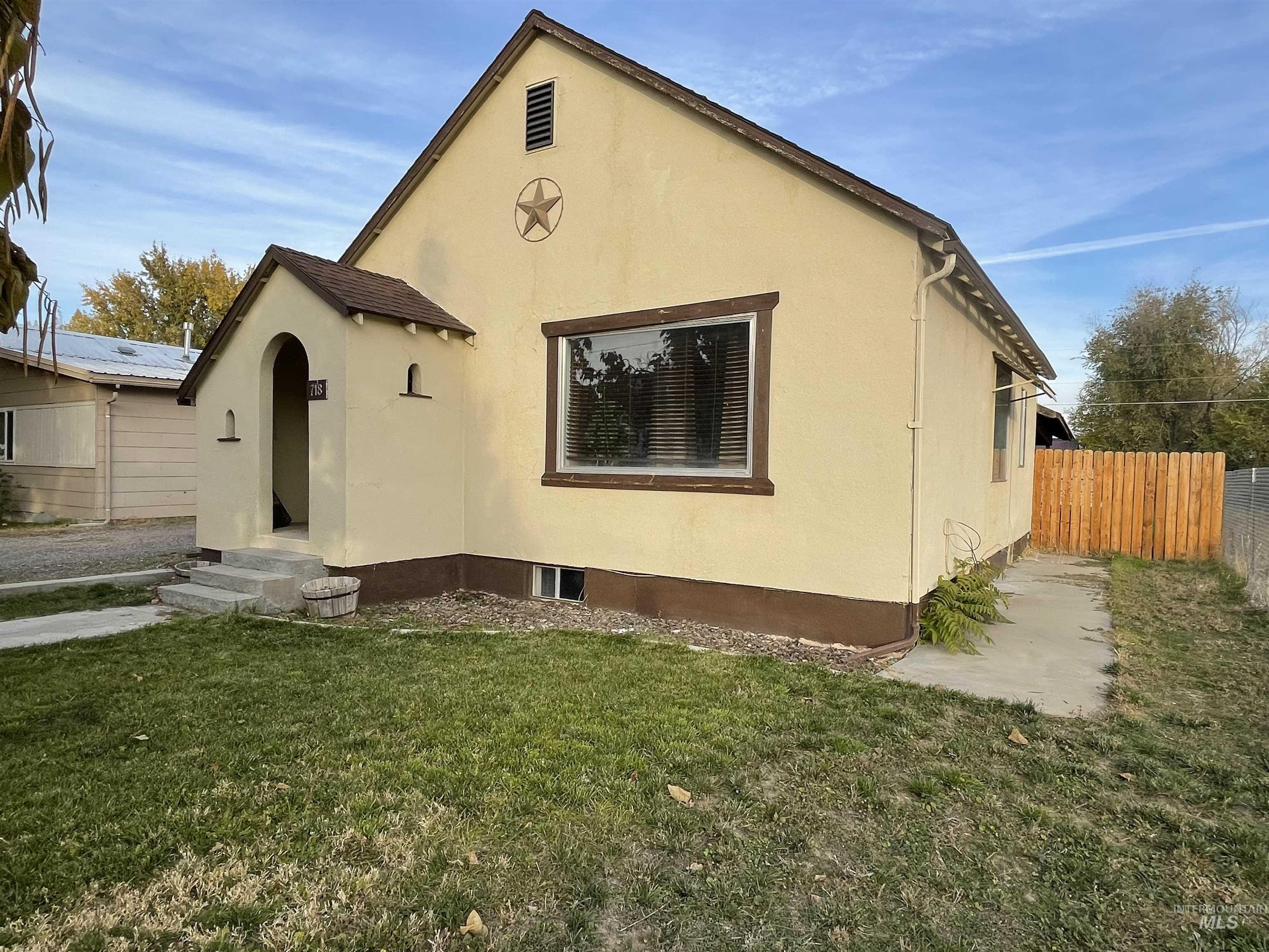 View of front of house featuring stucco siding