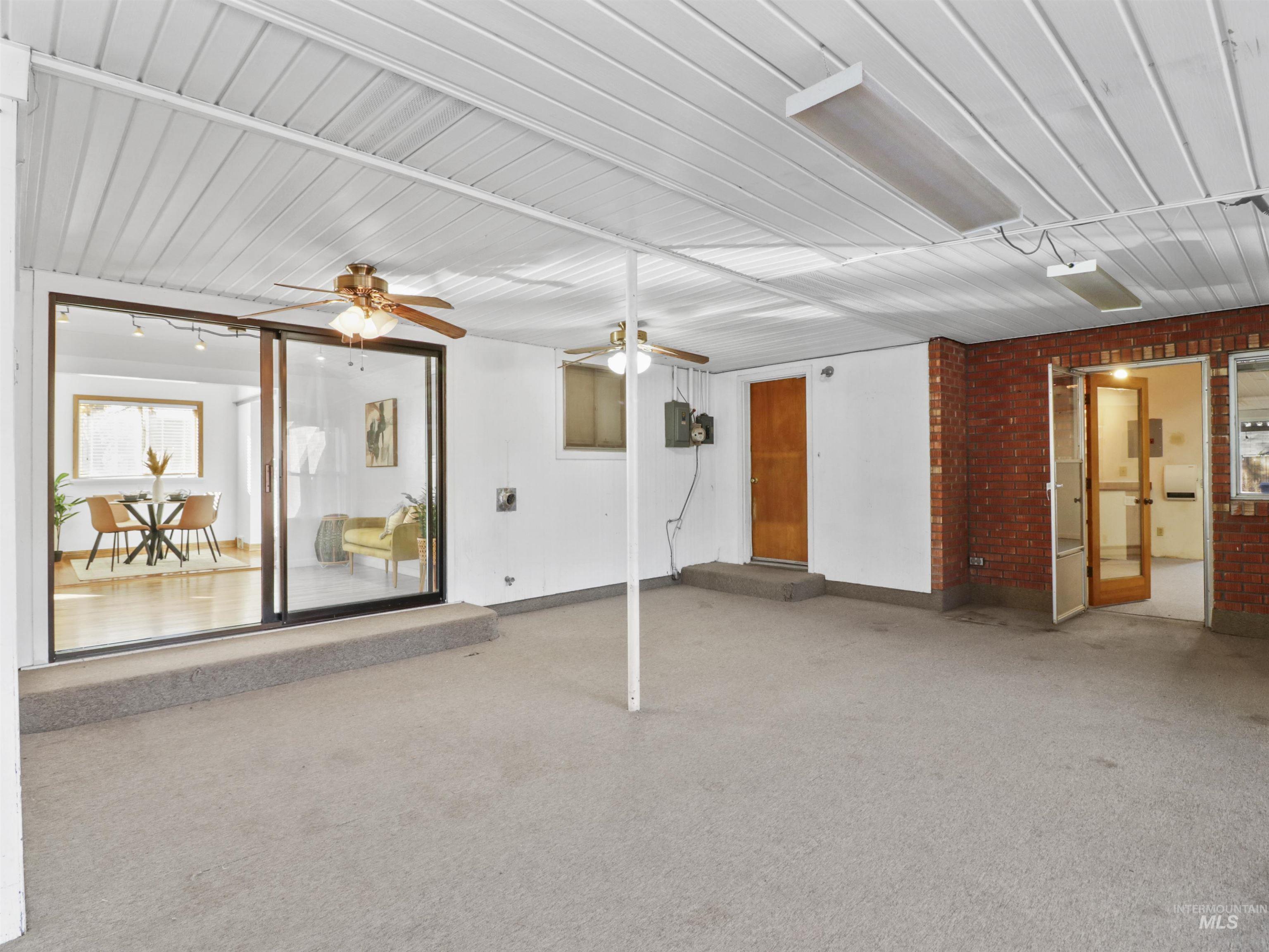View of patio featuring ceiling fan