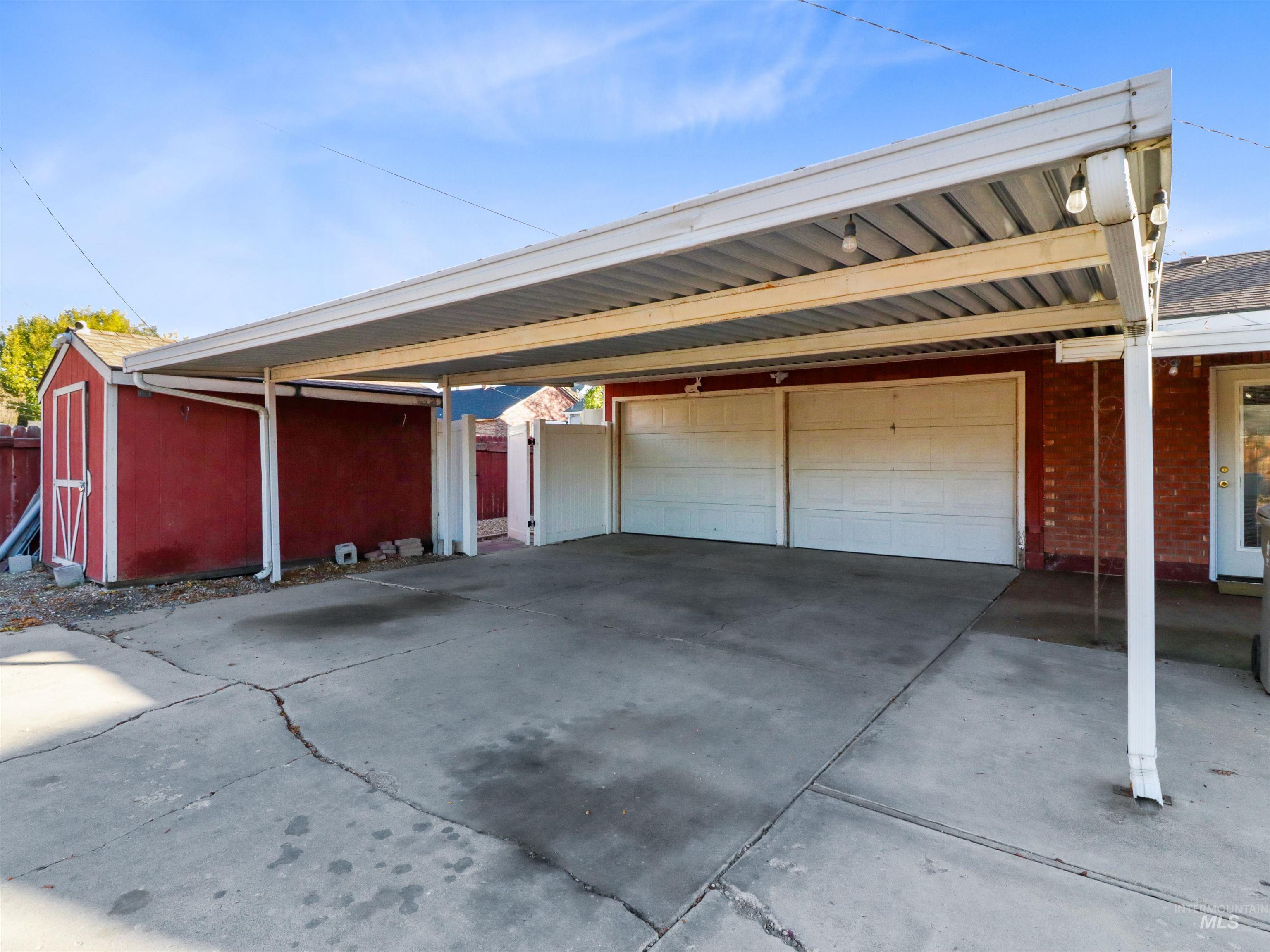 Garage featuring driveway