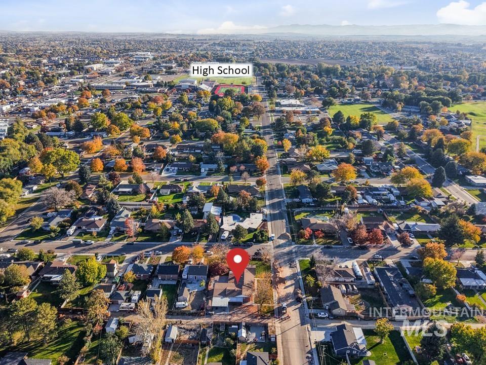 View of property location with nearby suburban area