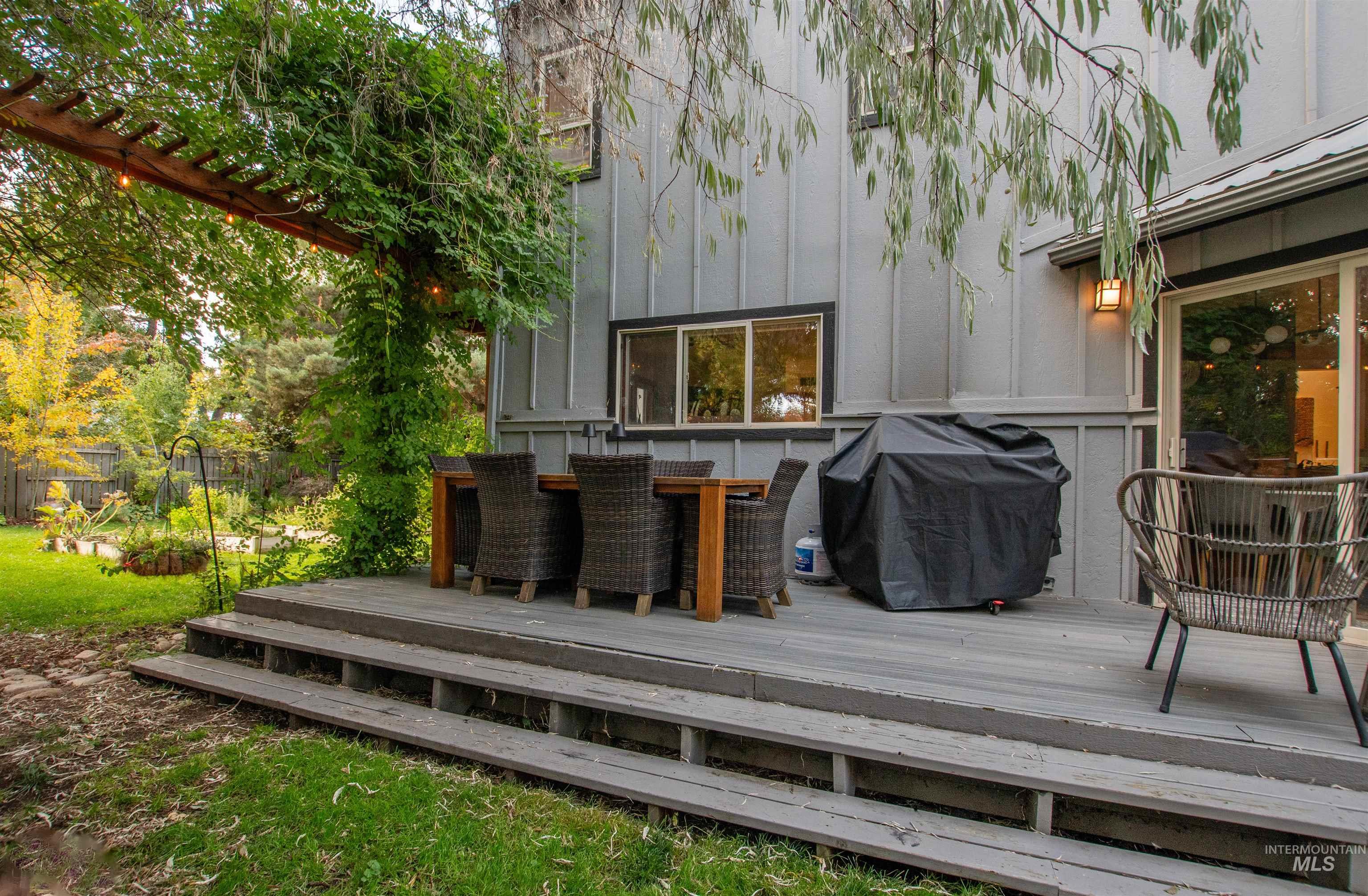 Deck with grilling area and outdoor dining space
