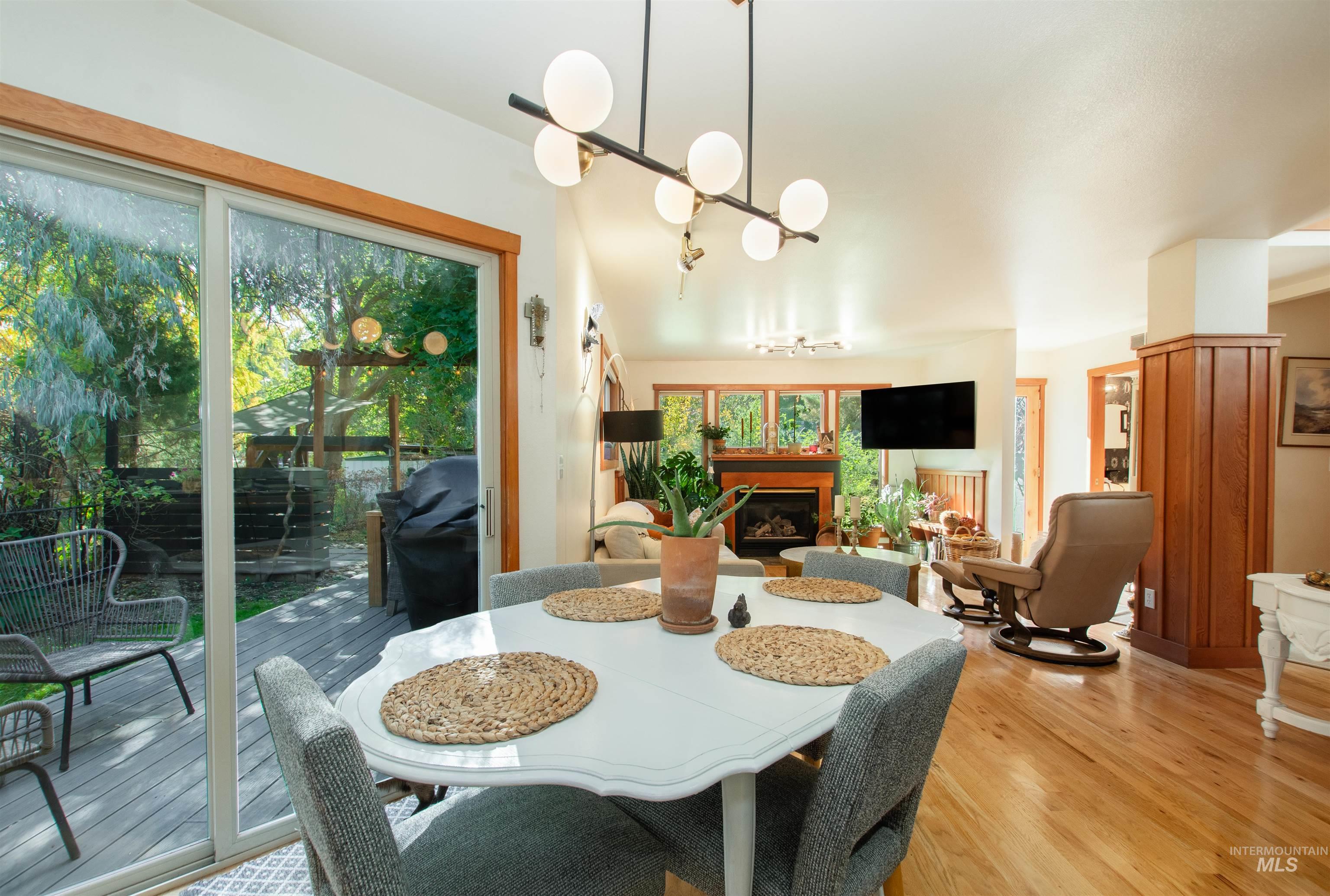 Dining space featuring a fireplace and wood finished floors