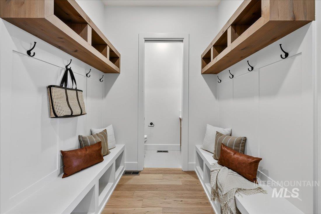 Mudroom featuring light wood-type flooring