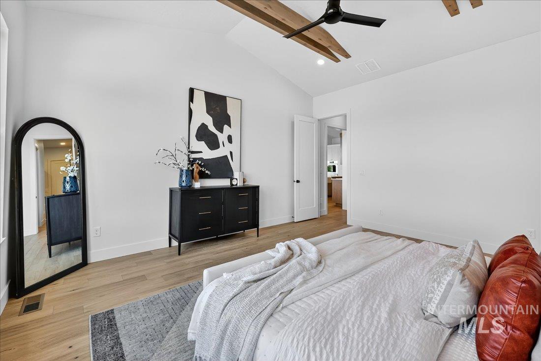Bedroom featuring light wood-style flooring, beam ceiling, high vaulted ceiling, recessed lighting, and a ceiling fan