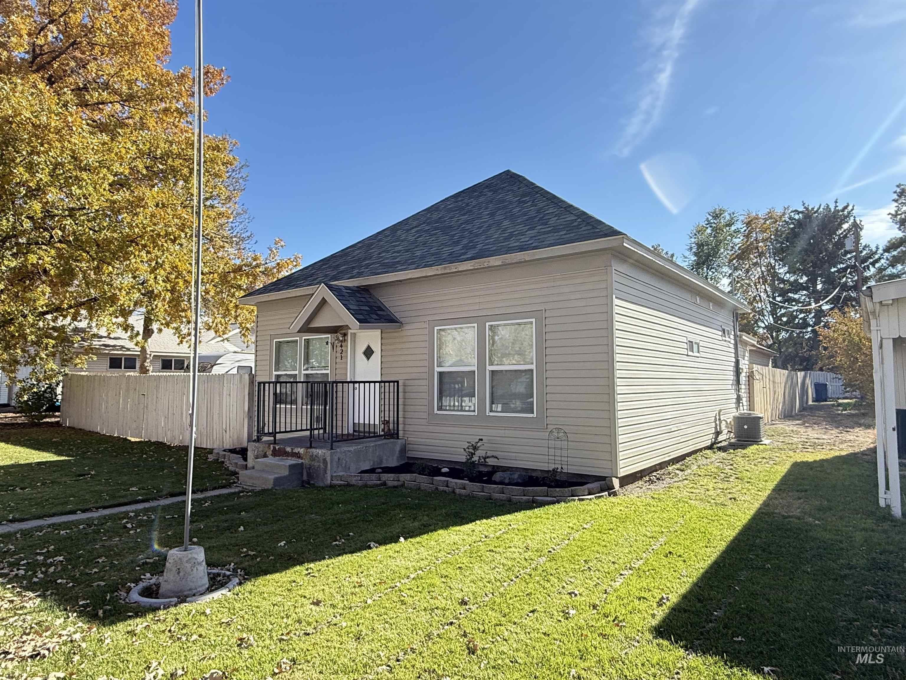 Back of property with roof with shingles