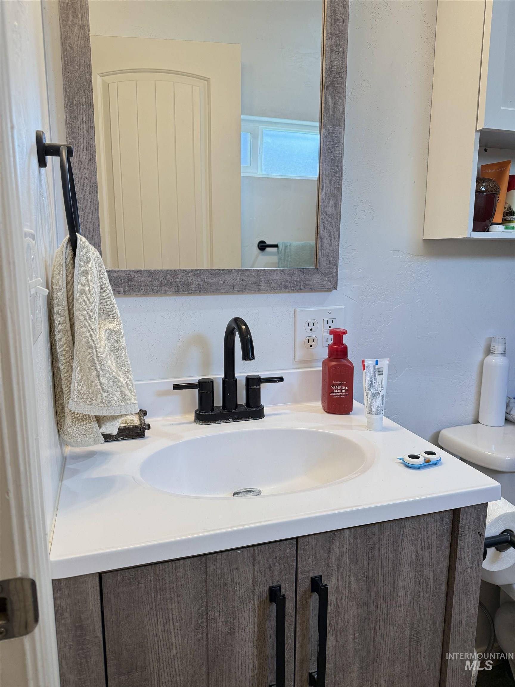 Bathroom featuring vanity and tub/shower