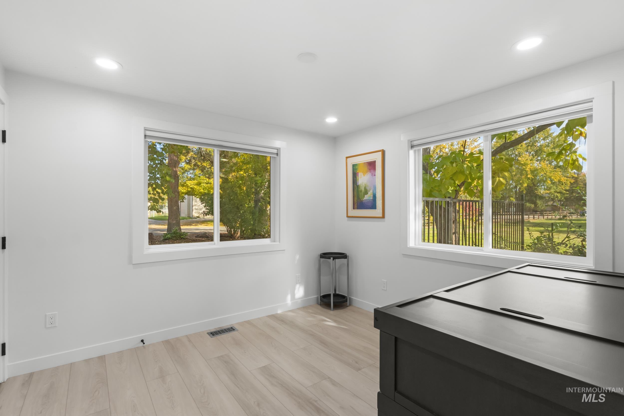 Rec room featuring light wood-style floors and recessed lighting