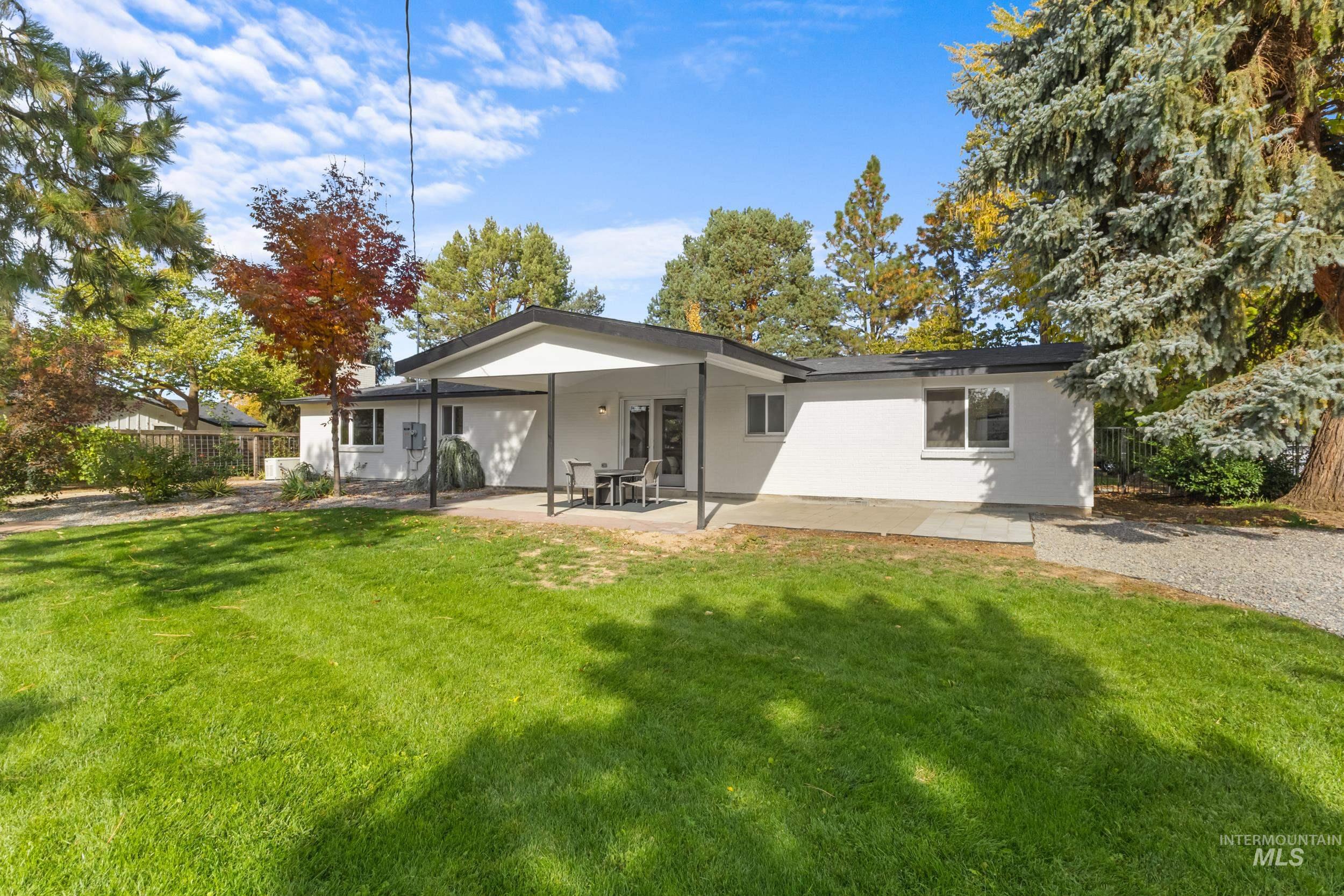 Rear view of house featuring a patio