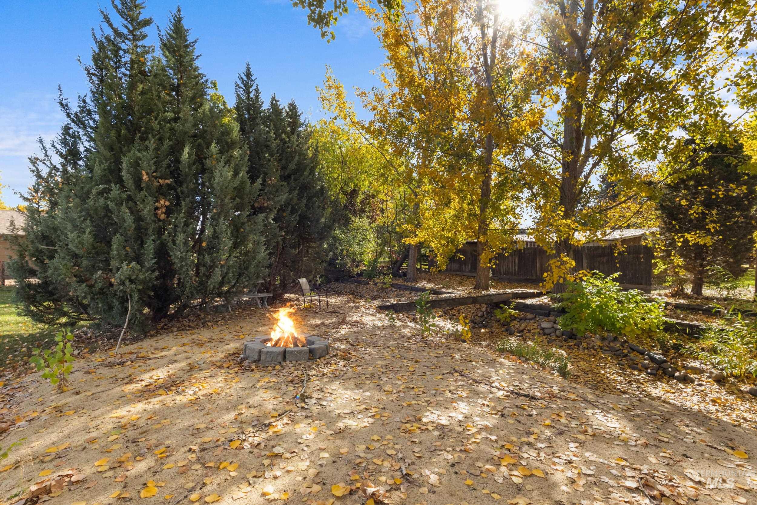 View of yard with a fire pit