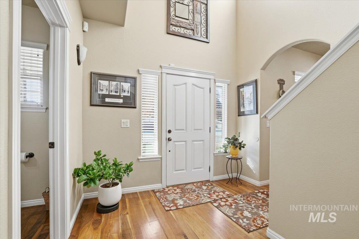 Entrance foyer with wood finished floors and plenty of natural light