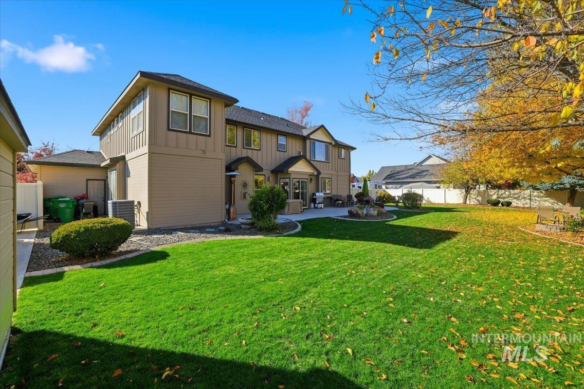 View of front facade featuring board and batten siding and a patio area