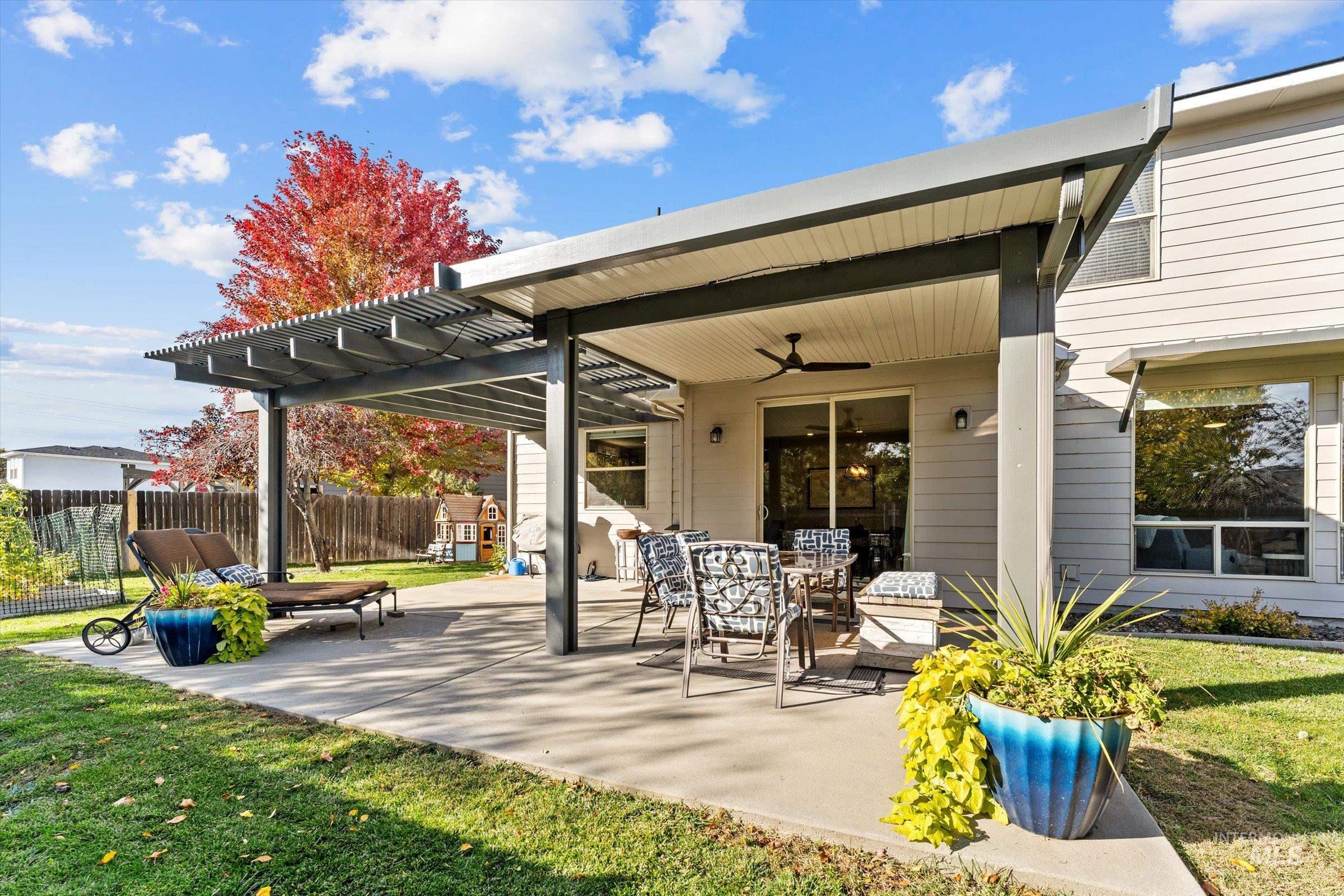 View of patio featuring a pergola and a ceiling fan